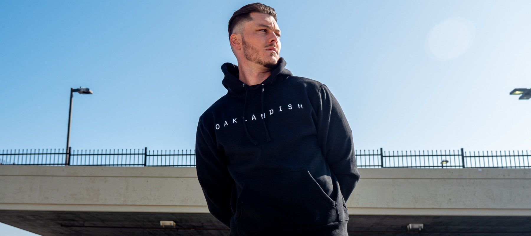 Male model wearing Oaklandish Classic Black pullover hoodie.