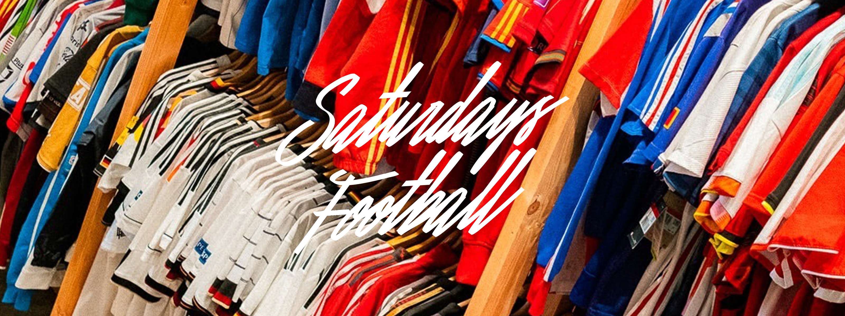 A rack of clothes with a red and yellow shirt.