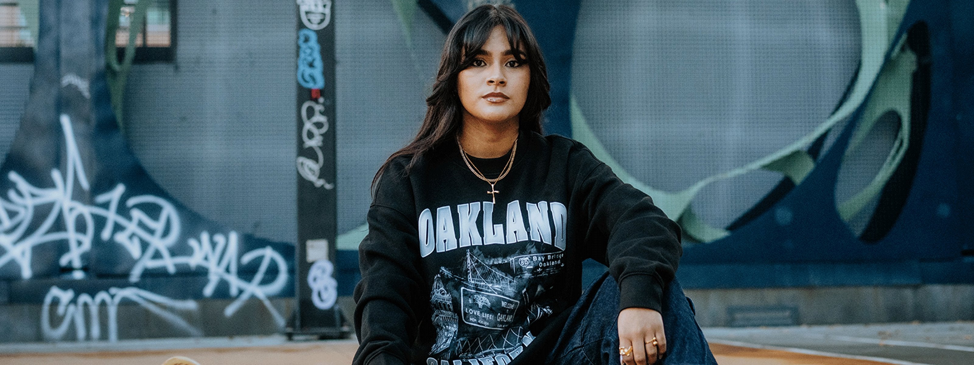 Model wearing natural viva Oakland tee.