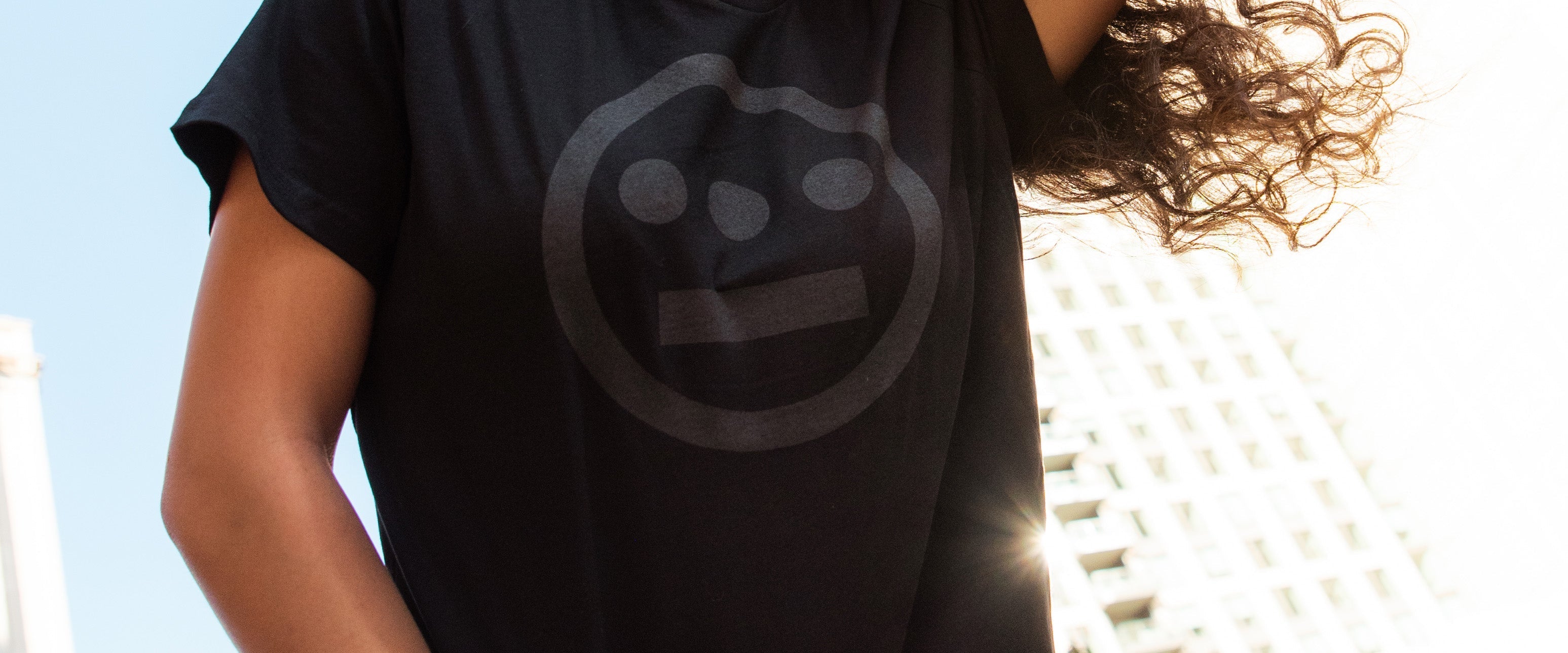 Women wearing black tee with black Hieroglyphics logo.