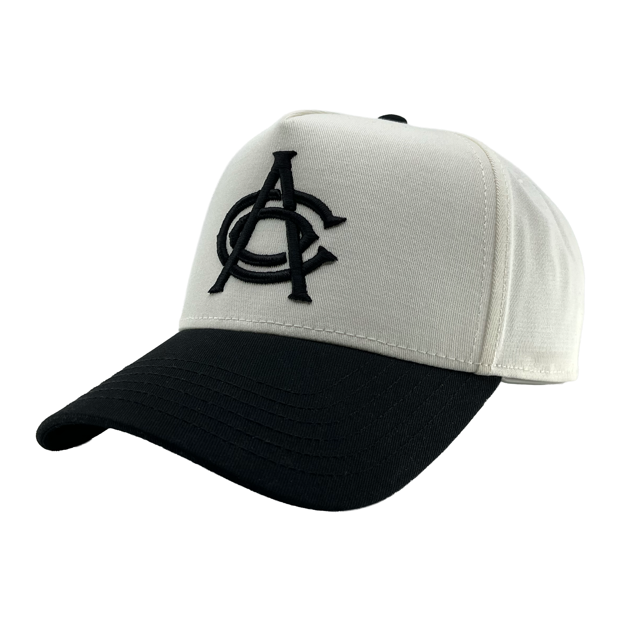 A white and black OAC Logo 5 Panel snapback cap with a curved black brim. The structured front showcases large, overlapping black embroidered “OAC” letters in a bold font—clearly representing the OAC brand. The cap is displayed against a plain, light gray background.