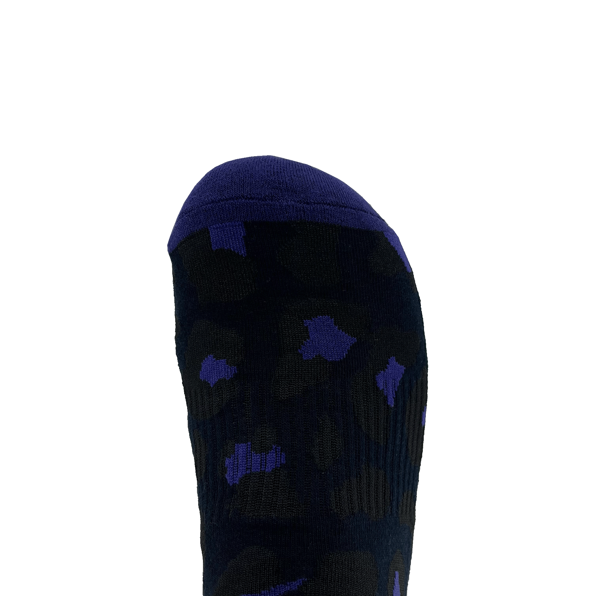 A close-up image of a sock-covered foot showcases Oaklandish's Panther Sock. The sock is primarily black with a dark blue toe cap and features a scattered pattern of blue spots. The plain white background emphasizes the design and colors of these one size fits most crew socks.