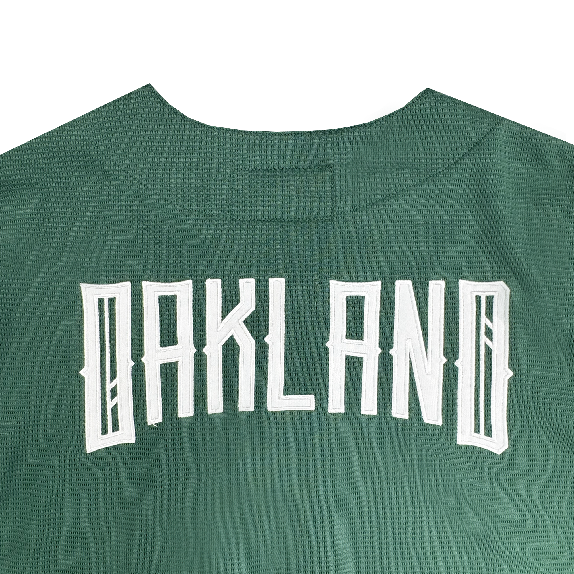 The Oakland Ballers Button Up Jersey features green mesh-textured fabric with "OAKLAND" in large white letters across the back, showcasing its connection to the Oakland Ballers brand.