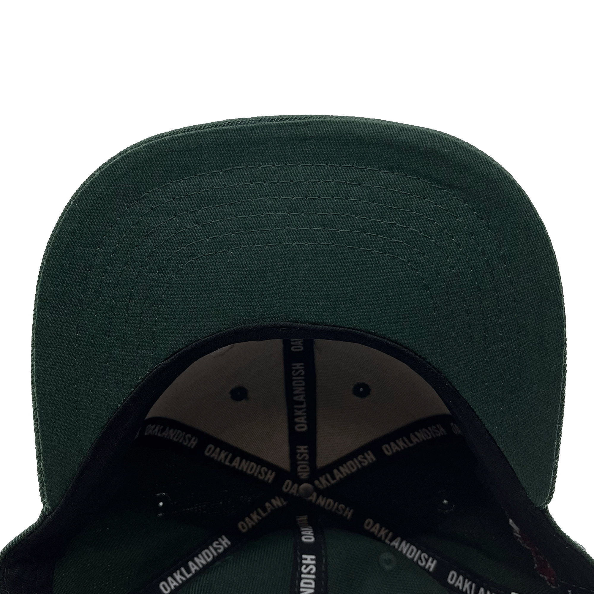 View of the underside of the green bill of a green cap with black striping and Oaklandish wordmark on repeat inside the crown.
