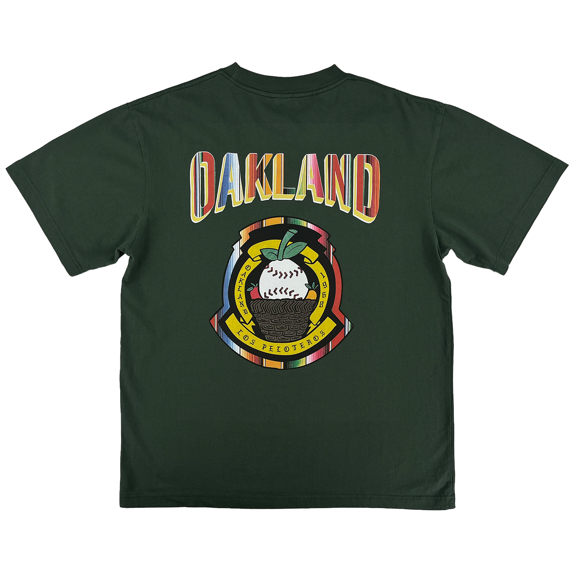 The Oakland Beisbol Tee by Oakland Ballers features a dark green design with bold “OAKLAND” in retro font on the back, plus a circular emblem below with a baseball, oak leaf, “LOS PELOTEROS,” and Pioneer League–inspired details.