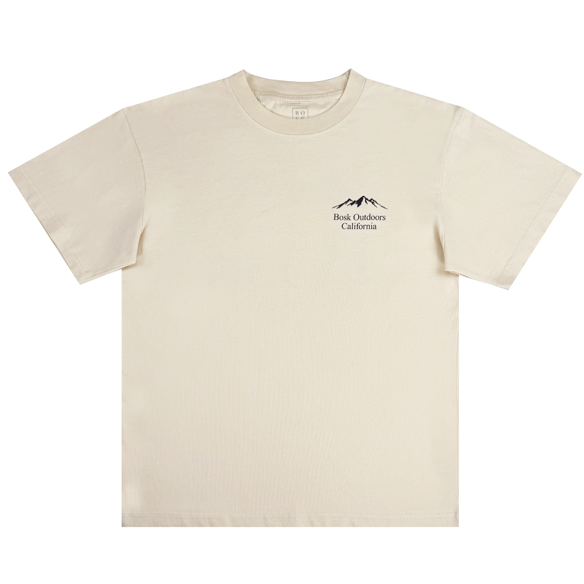The Bosk Outdoors Tee from BOSK is a beige, heavyweight cotton T-shirt with an oversized fit. It features short sleeves, a round neckline, and a small black logo on the left chest with mountain outlines and "Book Outdoors California,” designed for men with a soft, casual style.