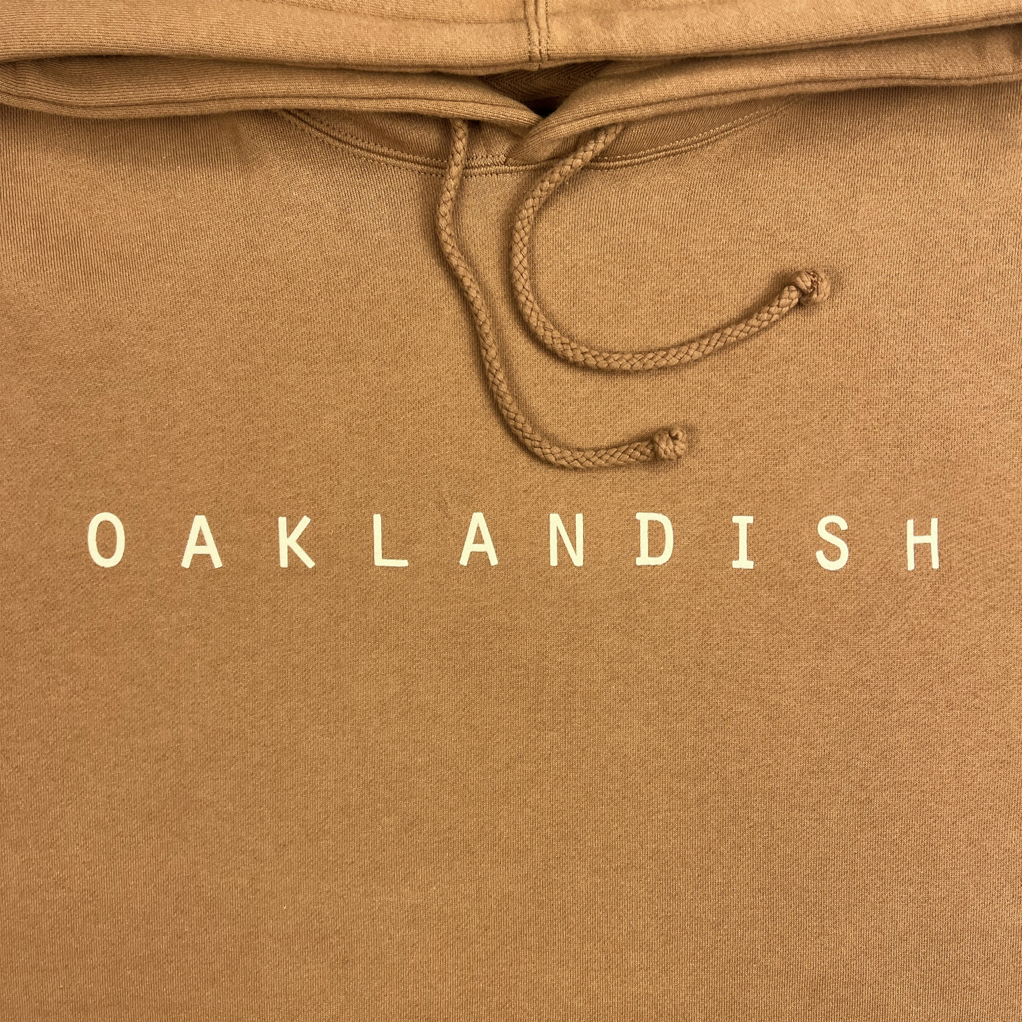 Detail front view of Premium pullover Hoodie - Classic Oaklandish, Saddle brown.