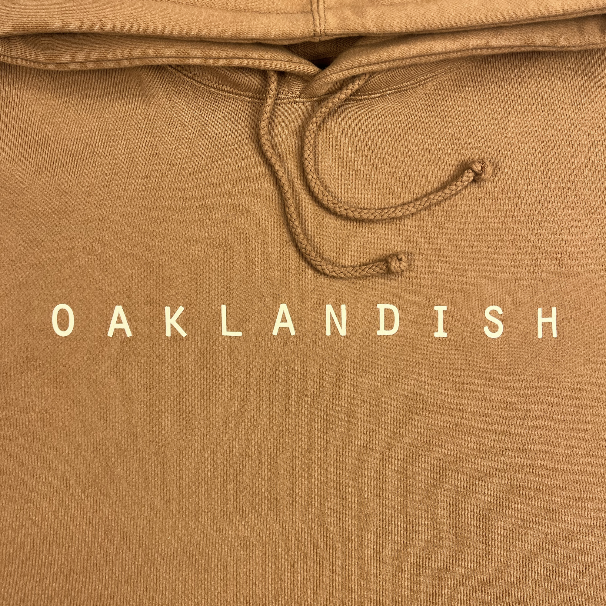 Detail front view of pullover Hoodie - Classic Oaklandish, Saddle brown.