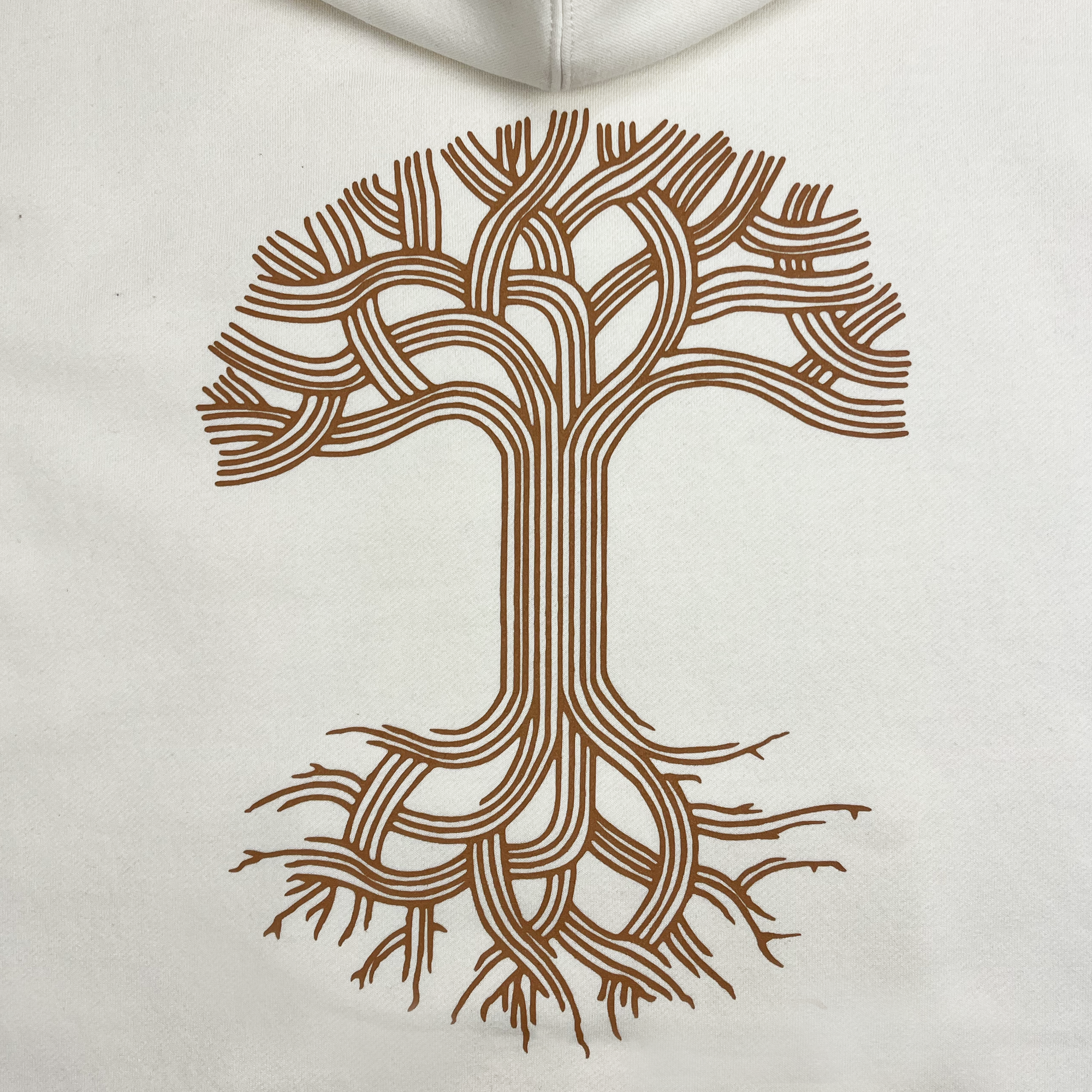 The Oaklandish Classic Hoodie by Oaklandish features a stylized tree design printed on a white background. The tree is illustrated with intricate, interwoven branches and roots in brown, forming a symmetrical pattern. The branches extend upwards and outwards while the roots spread below, creating a balanced and artistic image.