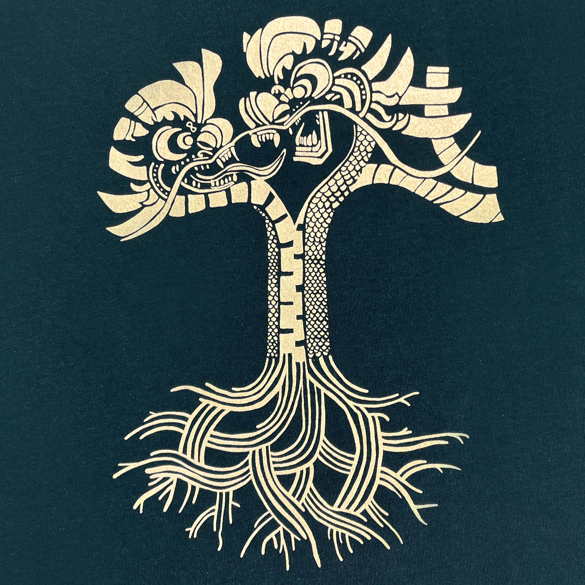 Detailed view of Dragon Power design in gold ink on pine tee.