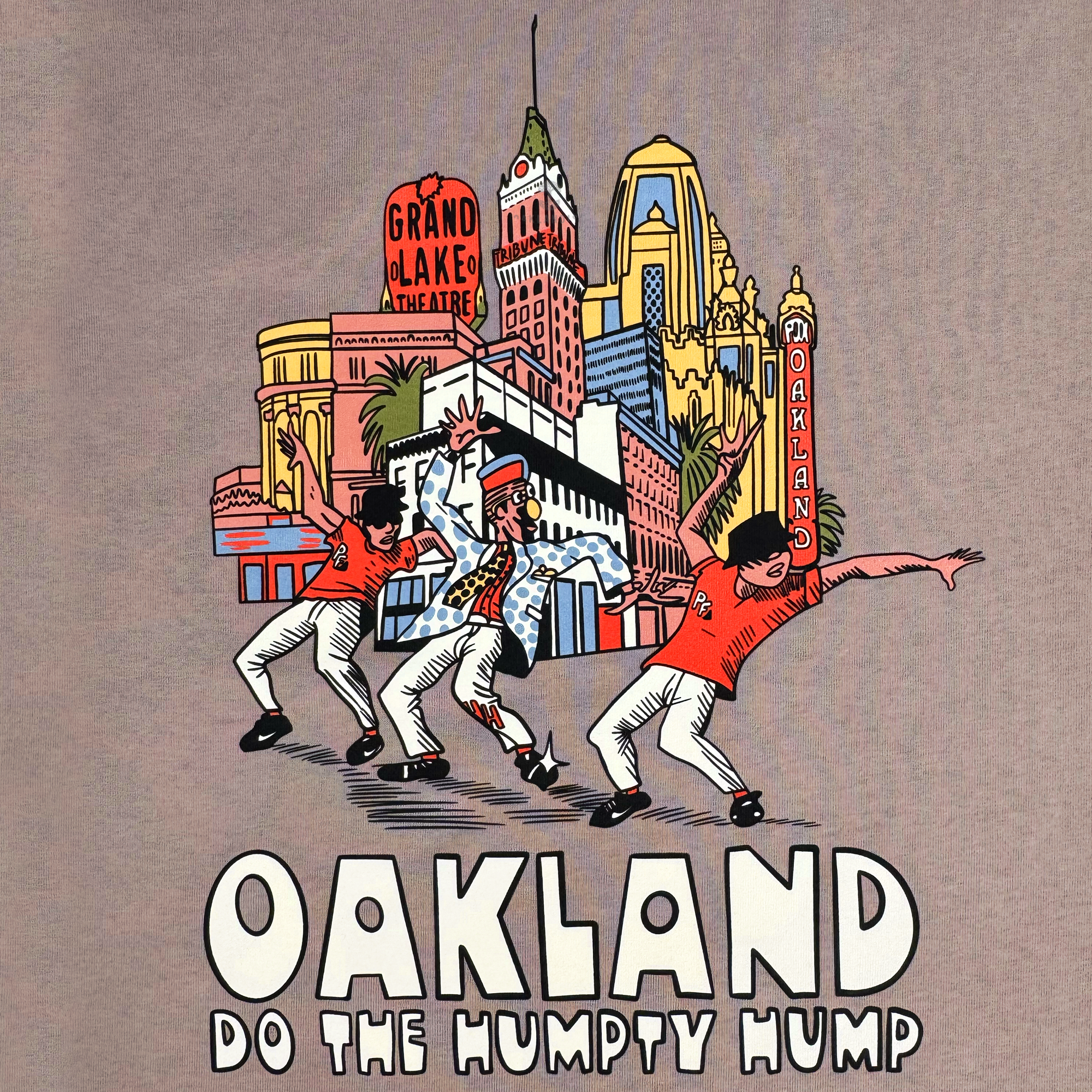 Three cartoon figures dance in vivid attire against Oakland's skyline, featuring landmarks like Grand Lake Theatre. "OAKLAND DO THE HUMPTY HUMP" is boldly written at the bottom, reflecting Digital Underground's iconic style. Product: Do the Humpty Hump Heavy Tee by Oaklandish.