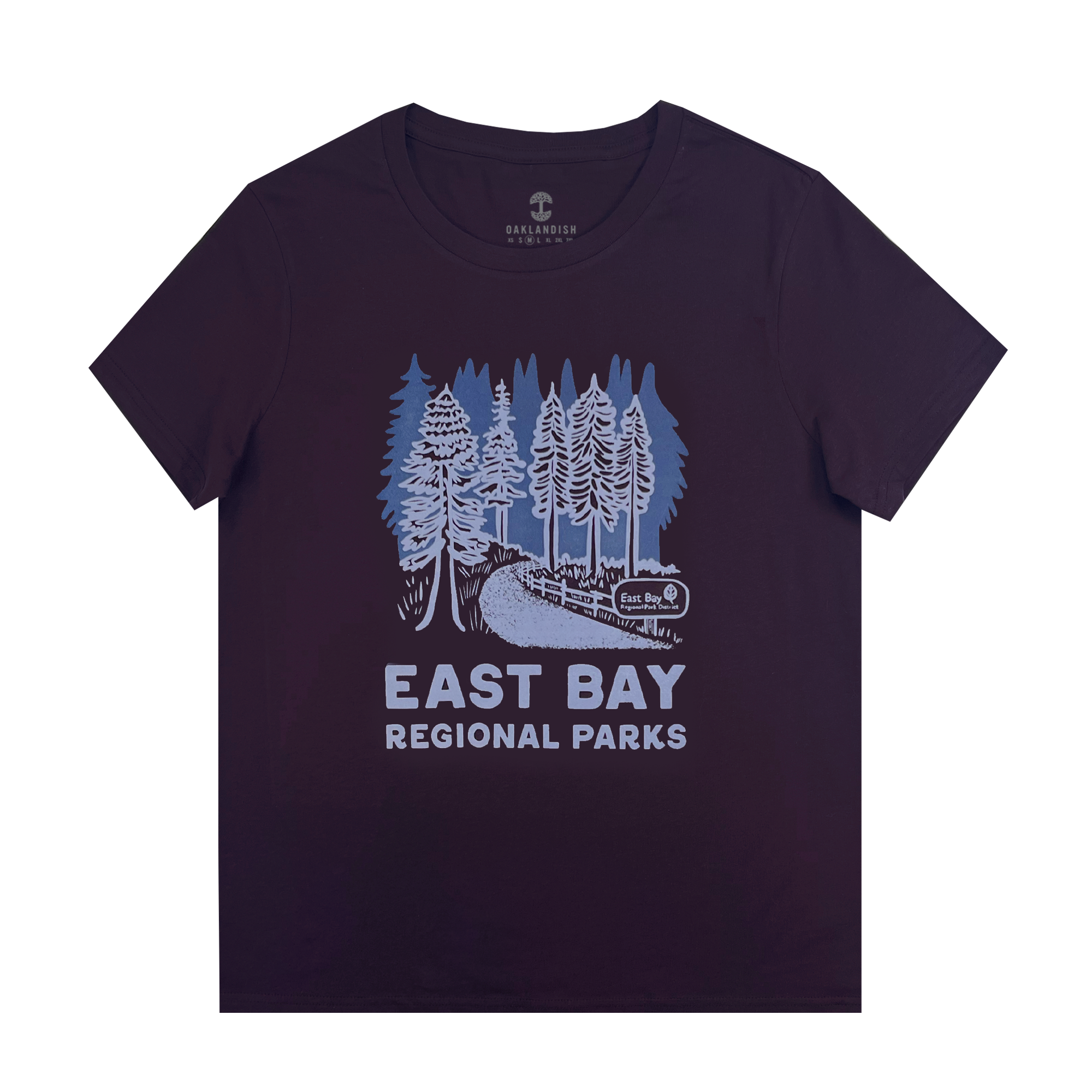 The Women's East Bay Regional Parks Tee by Other is a black 100% cotton classic fit shirt with a light blue graphic of tall pines, winding path, "East Bay" park sign, and bold "EAST BAY REGIONAL PARKS" text below. Shirt shown flat on white background.