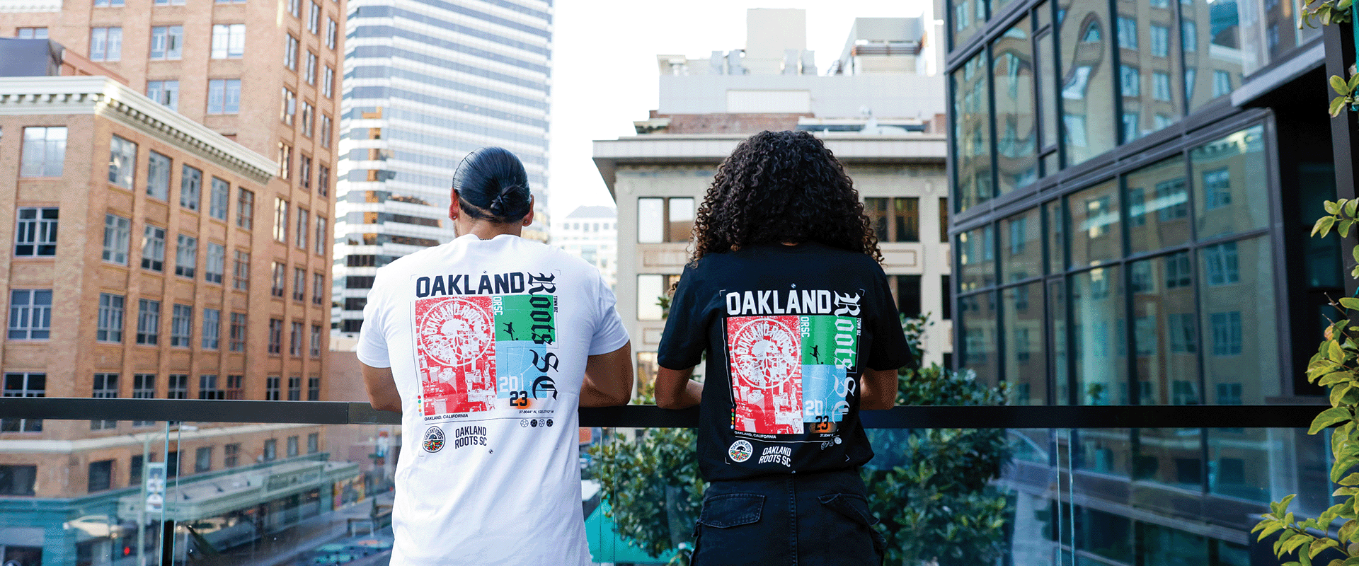 Models wearing Oakland Roots SC Futbol Town Tee