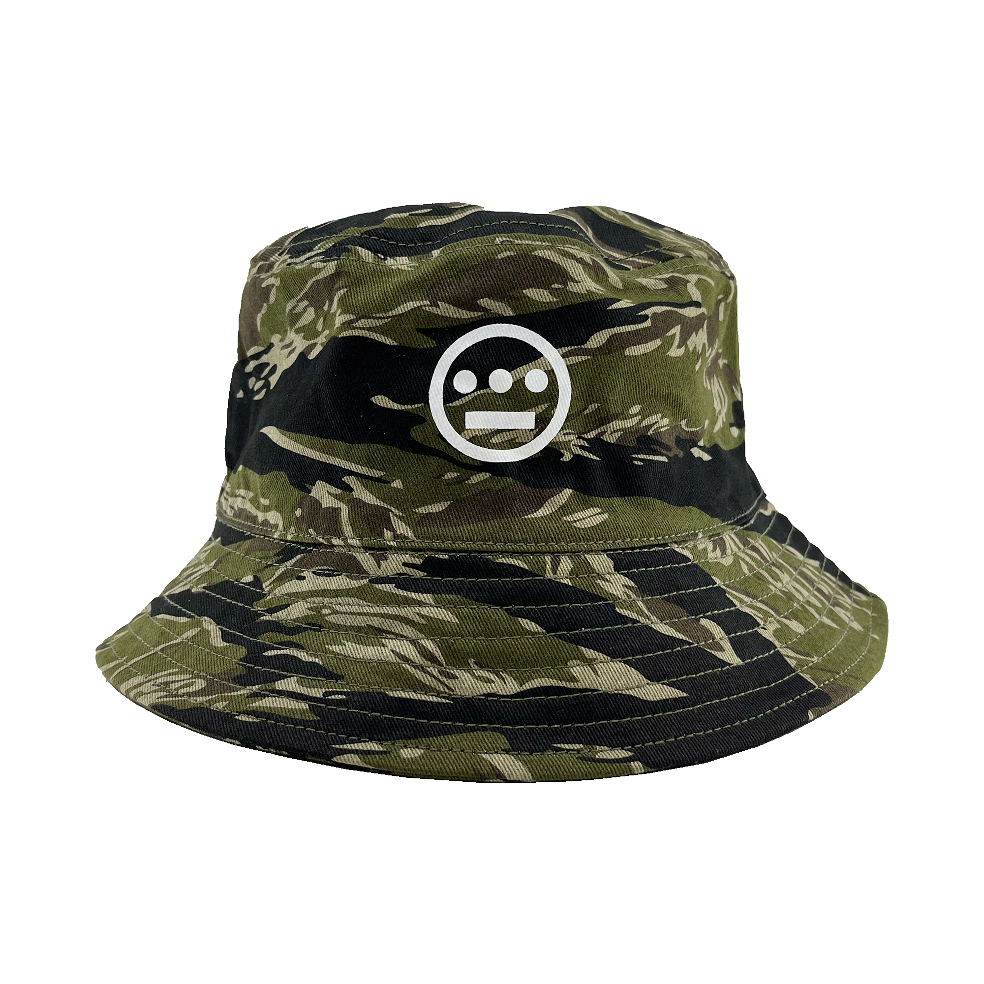 Introducing the Hieroglyphics Hiero Reversible Camo Bucket: A stylish bucket hat featuring a green and black tiger camo pattern, adorned with a white embroidered hieroglyphic symbol on the front. The unique symbol showcases a horizontal line with three dots above it, encased within a circle. This versatile hat boasts a wide, stitched brim and offers a relaxed, casual fit perfect for any occasion.