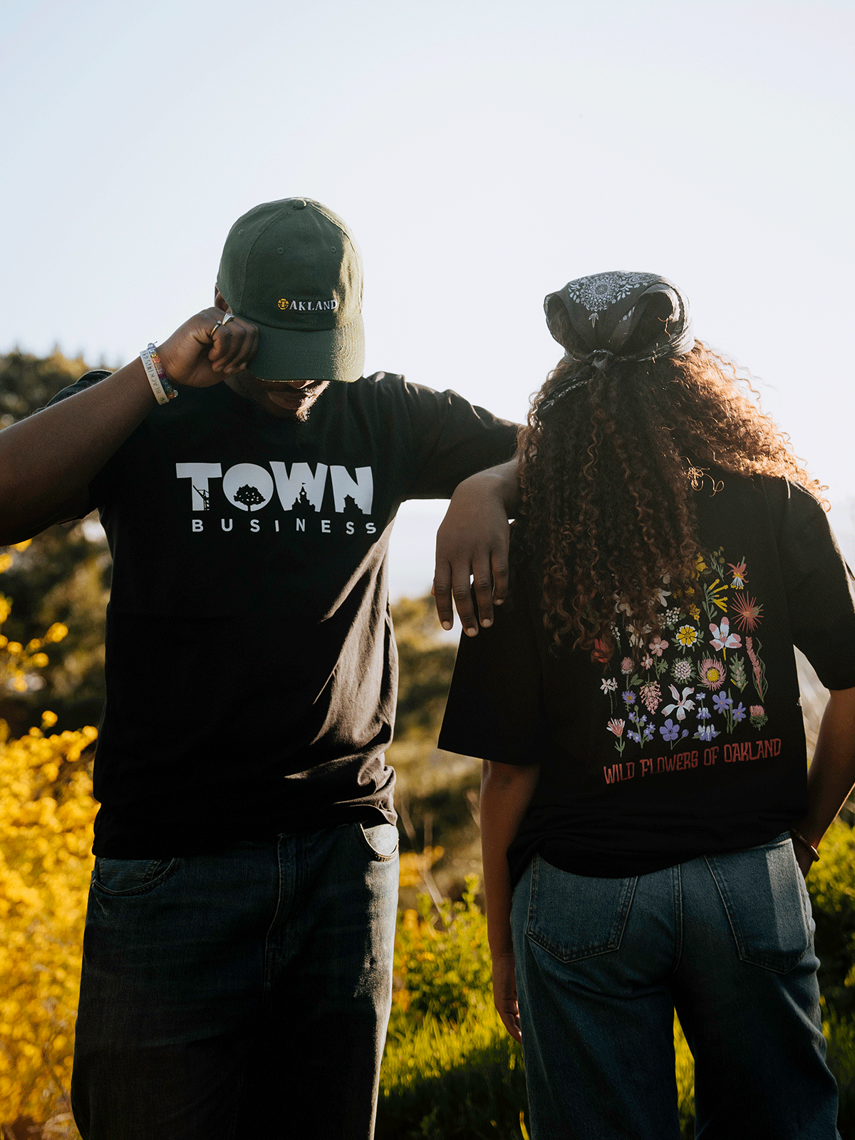 Models wearing town business tee and wildflower.