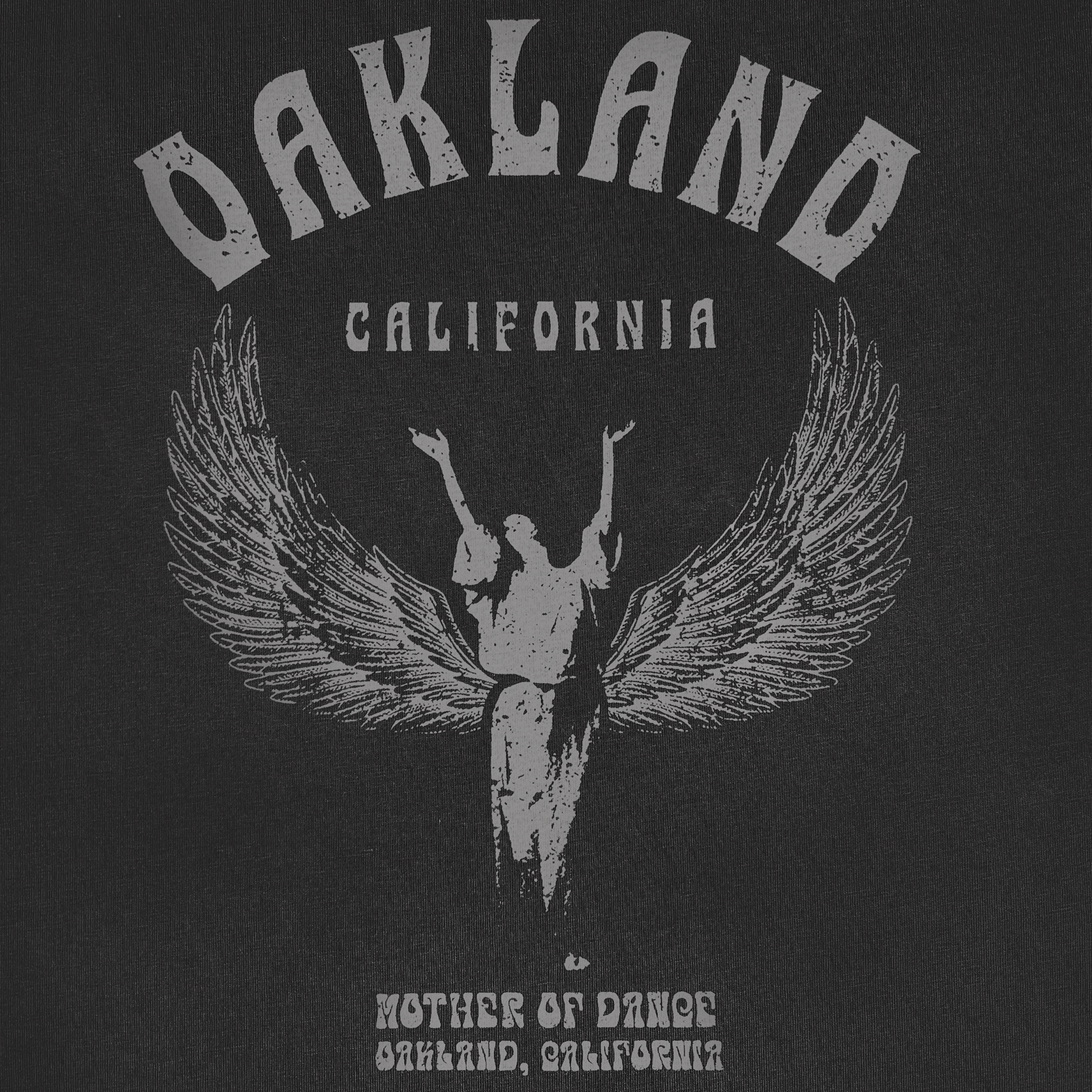 Detailed close up of Oakland California graphic celebrating Isadora Duncan, pioneer of modern dance on a faded black t-shirt.