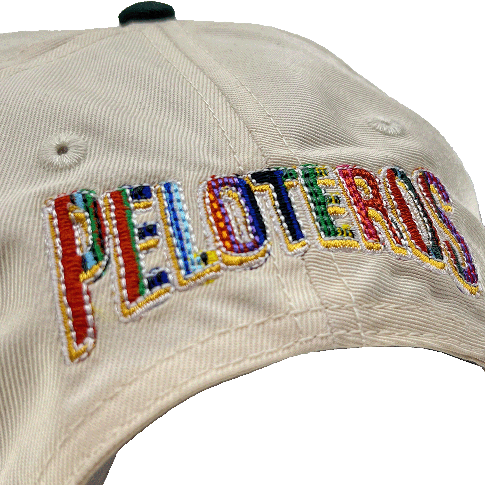 A close-up of the Oakland Ballers’ Oakland Beisbol 5 Panel Cap, featuring “PELOTEROS” embroidered in bold, multicolored letters. The vibrant stitching echoes the lively spirit of the team and makes this cap a unique accessory.