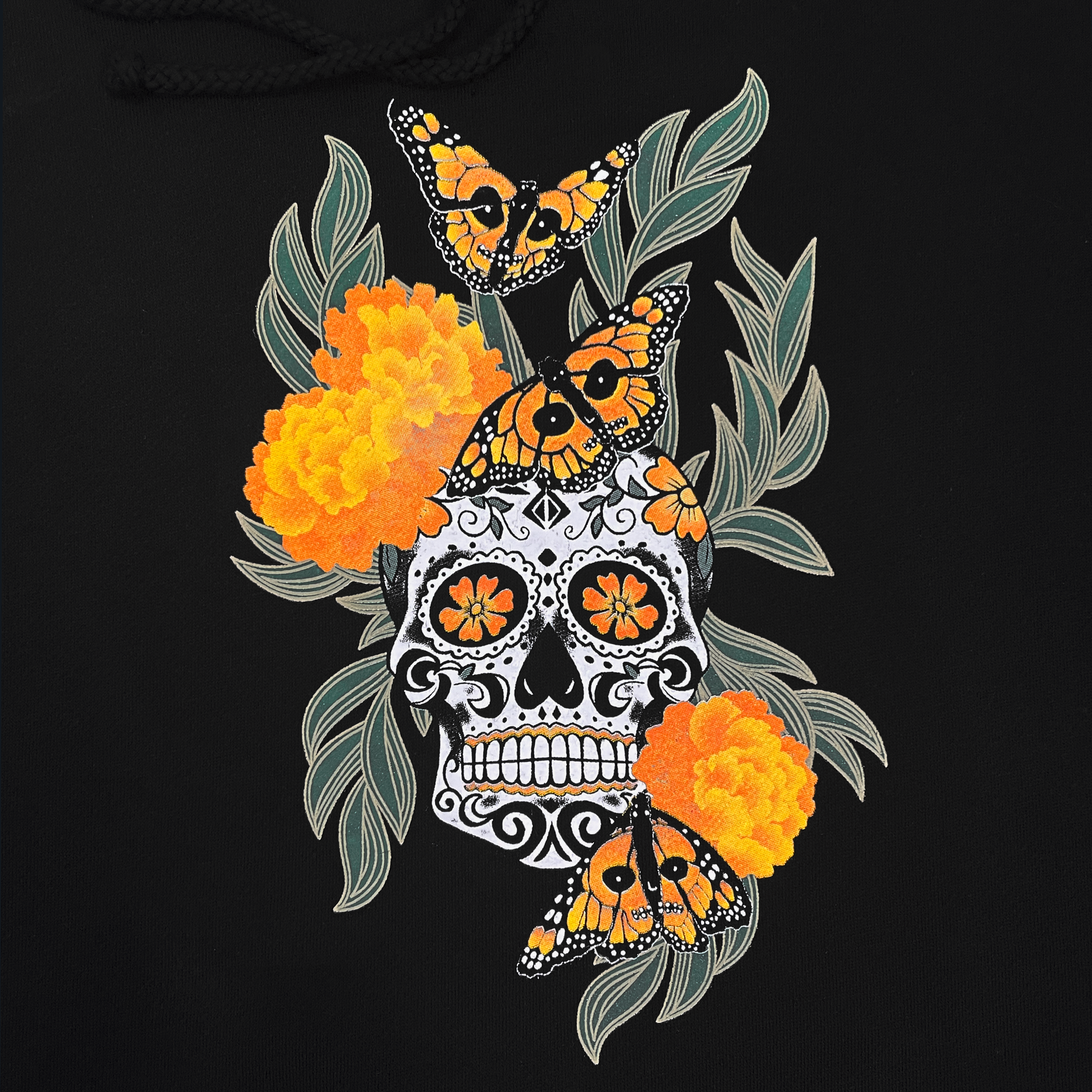 Detail image of sugar skull surrounded by 3 flowers and 3 butterflies.