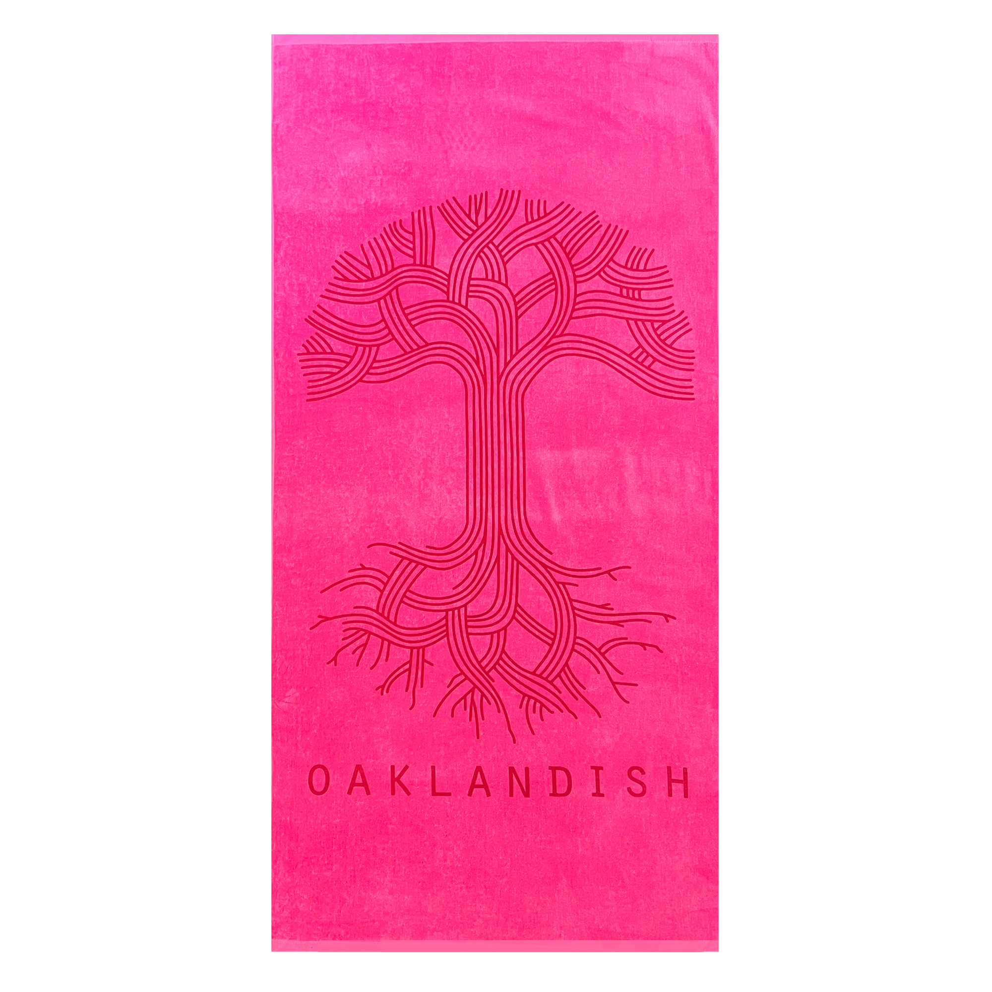 The Classic Logo Beach Towel by Oaklandish is a vibrant, oversized bright pink towel made from 100% ringspun cotton. It features an intricate, stylized tree design with intertwining branches and roots in the center. Below the tree, "OAKLANDISH" is printed in bold font, adding to its luxury and eye-catching appearance.