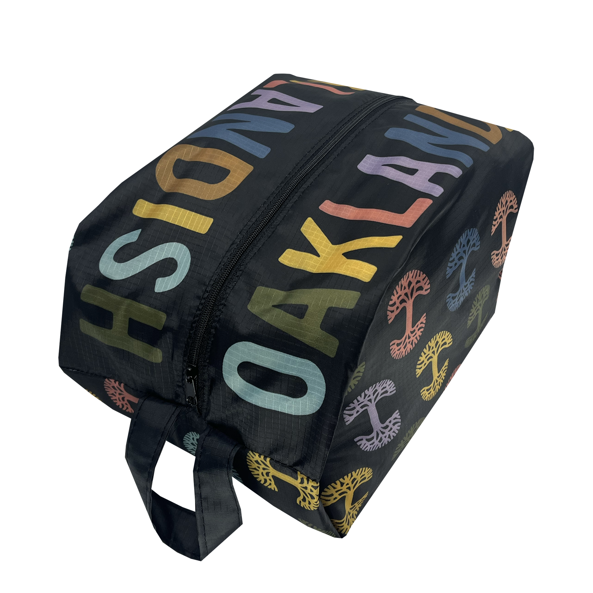 Side view of a black zippered cosmetic and toiletry dopp bag with multi-color Oaklandish tree logos on repeat and Oaklandish wordmarks on the top.