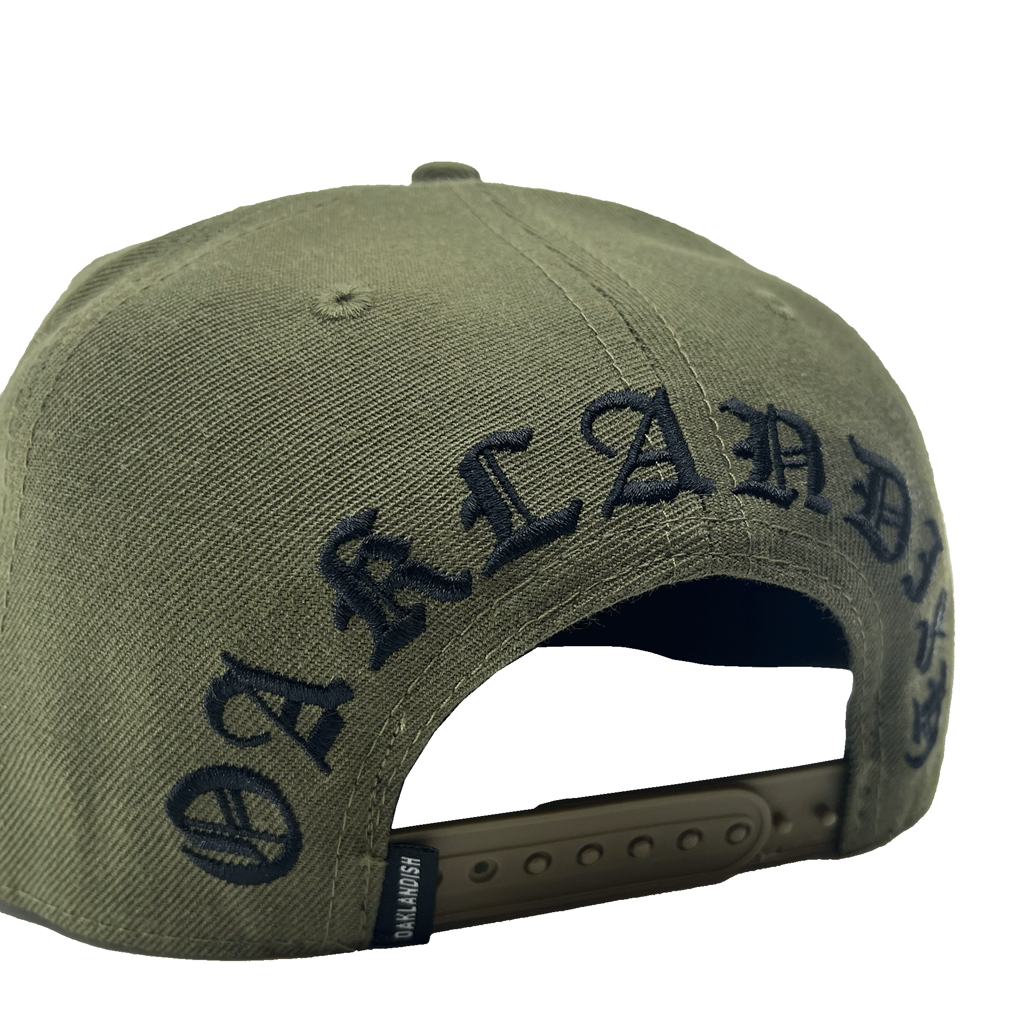 Side angled back view of green hat with snapback closure and small Oaklandish logo with large black embroidered Oaklandish wordmark in Old English script.