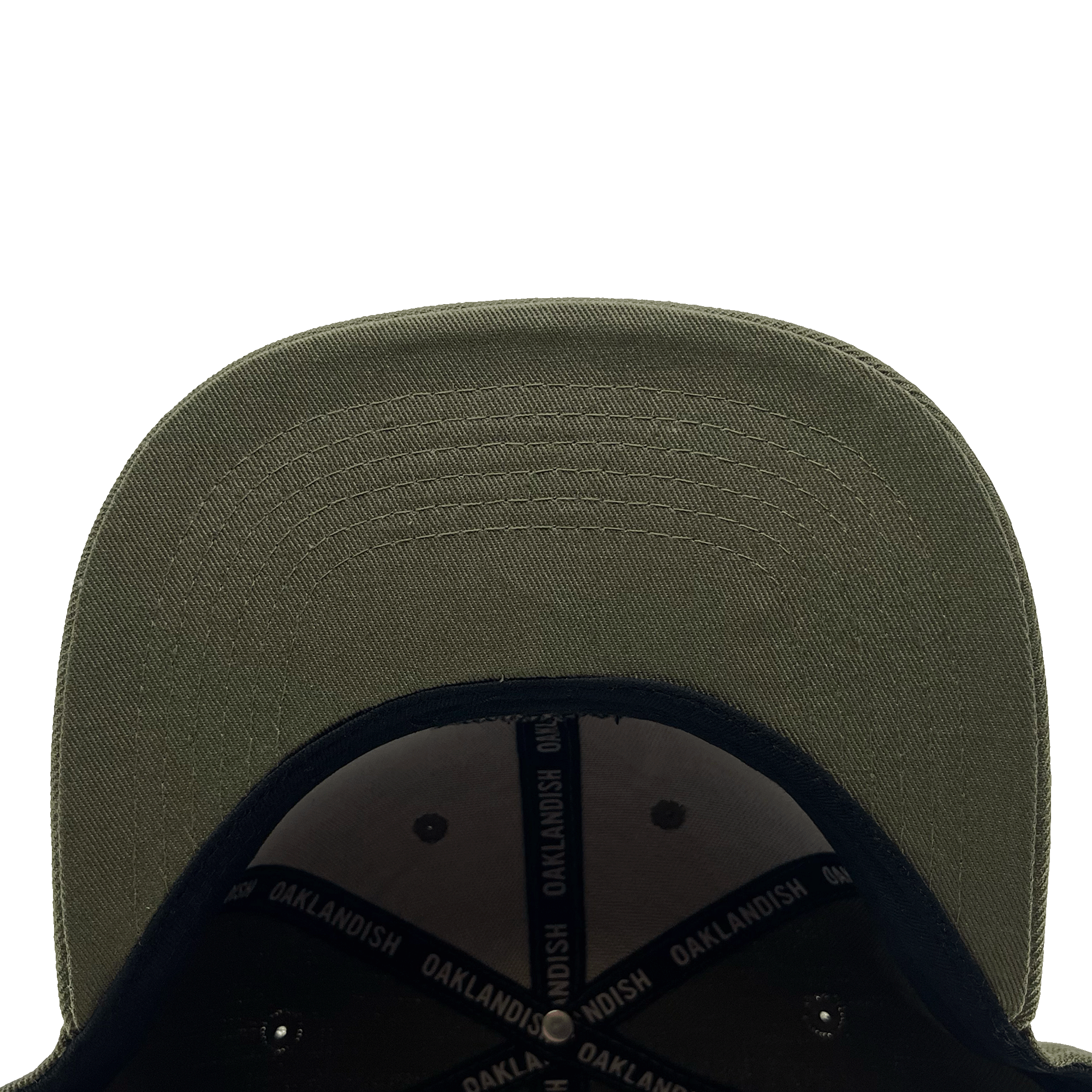 Close-up view of the underside of the Old English Aft Snapback's green brim. The stitching detail on the brim is clearly visible. The interior of this adjustable snapback cap by Oaklandish features a black lining with "OAKLANDISH" repeatedly printed in white on the inner bands. The background is plain white.