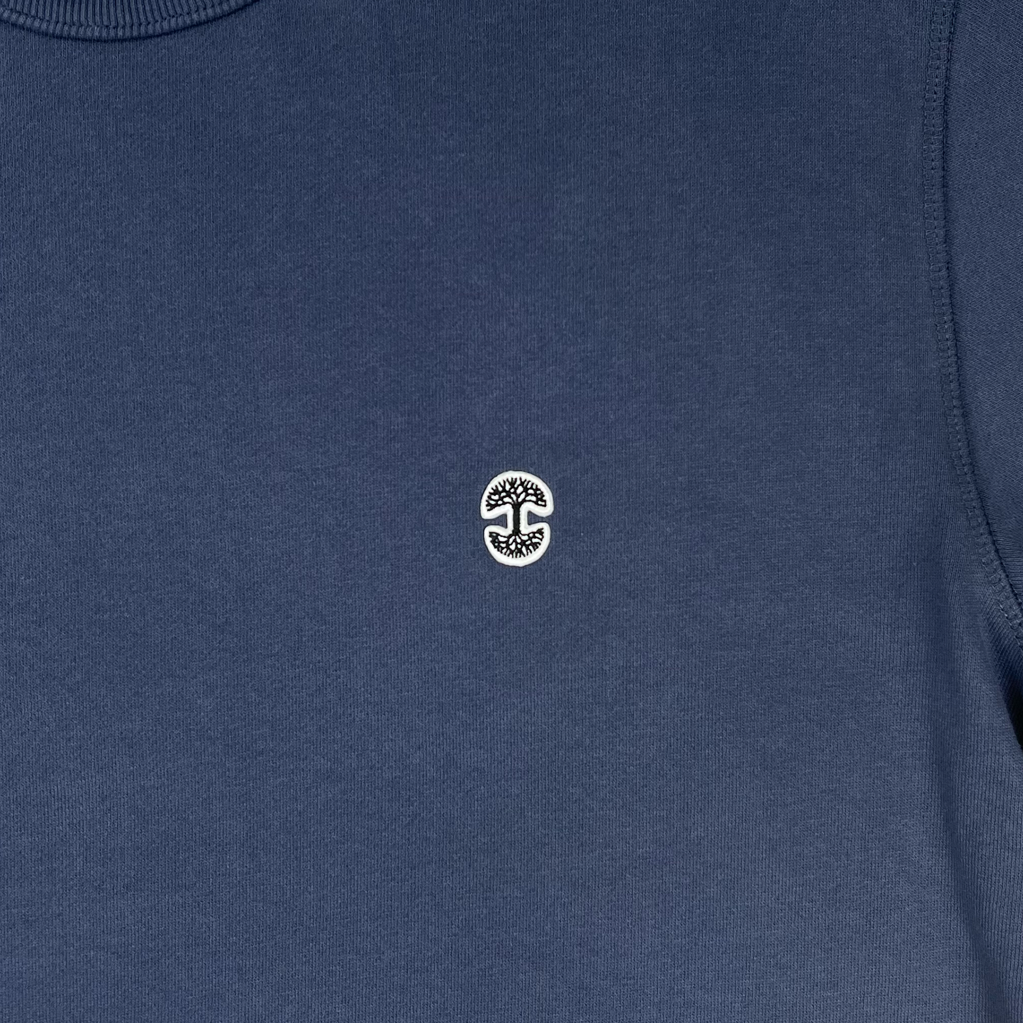 Detailed front view of Premium crewneck sweatshirt - Oaklandish tree logo, Petrol Blue.