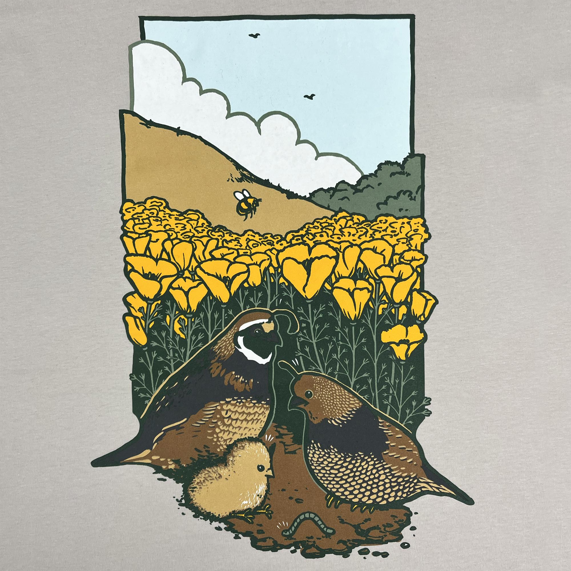 The Women's Quail Family Tee by Other features a scene of two quails and a chick with golden poppies on a classic fit 100% cotton t-shirt. One quail holds a worm in its beak against rolling hills and blue sky, celebrating earthy tones in women's sizing.