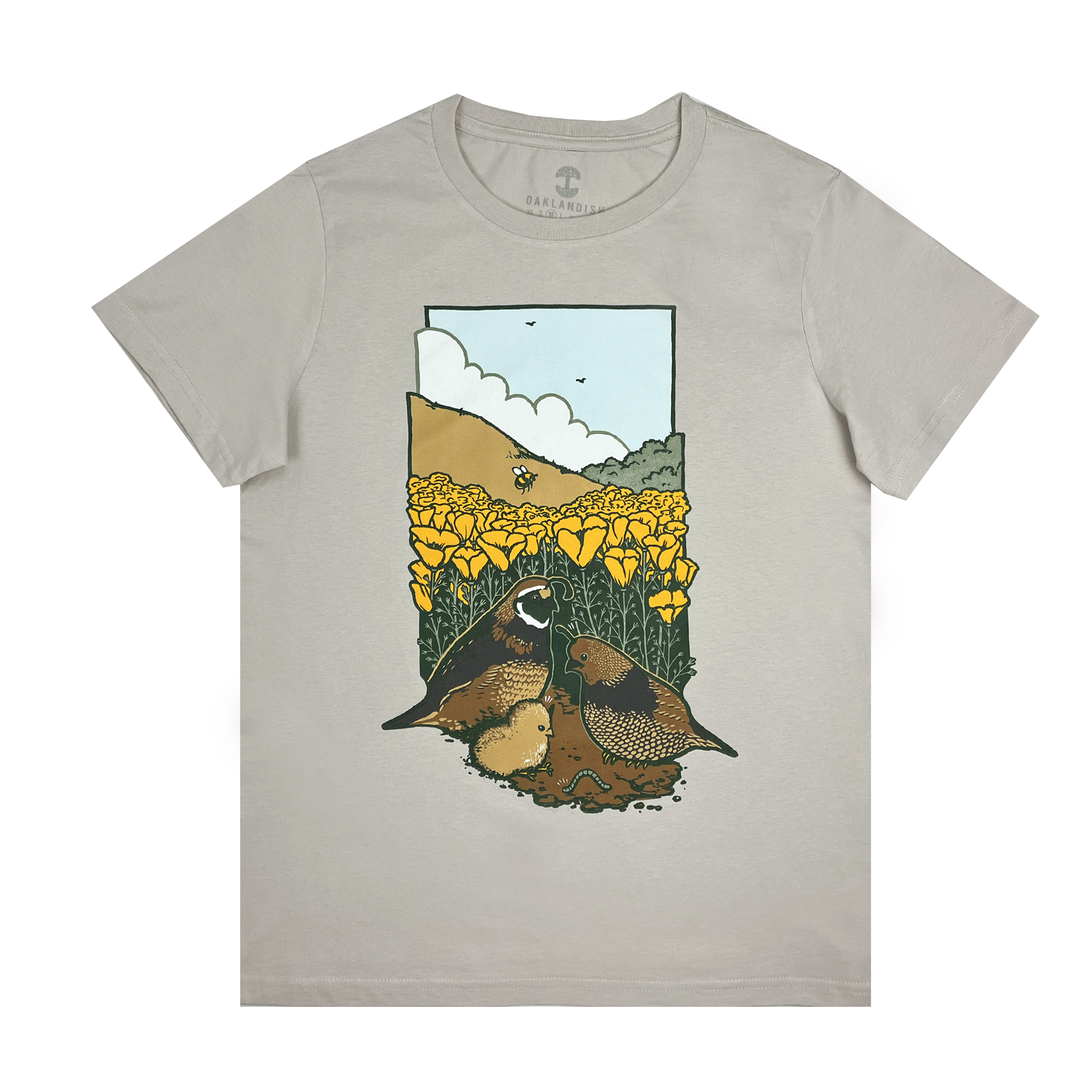 The Women's Quail Family Tee by Other features a classic fit with a vibrant graphic of quails and chicks in yellow poppies, flying birds, and earthy tones against a bright sky. Made from 100% cotton, it combines comfort and style.