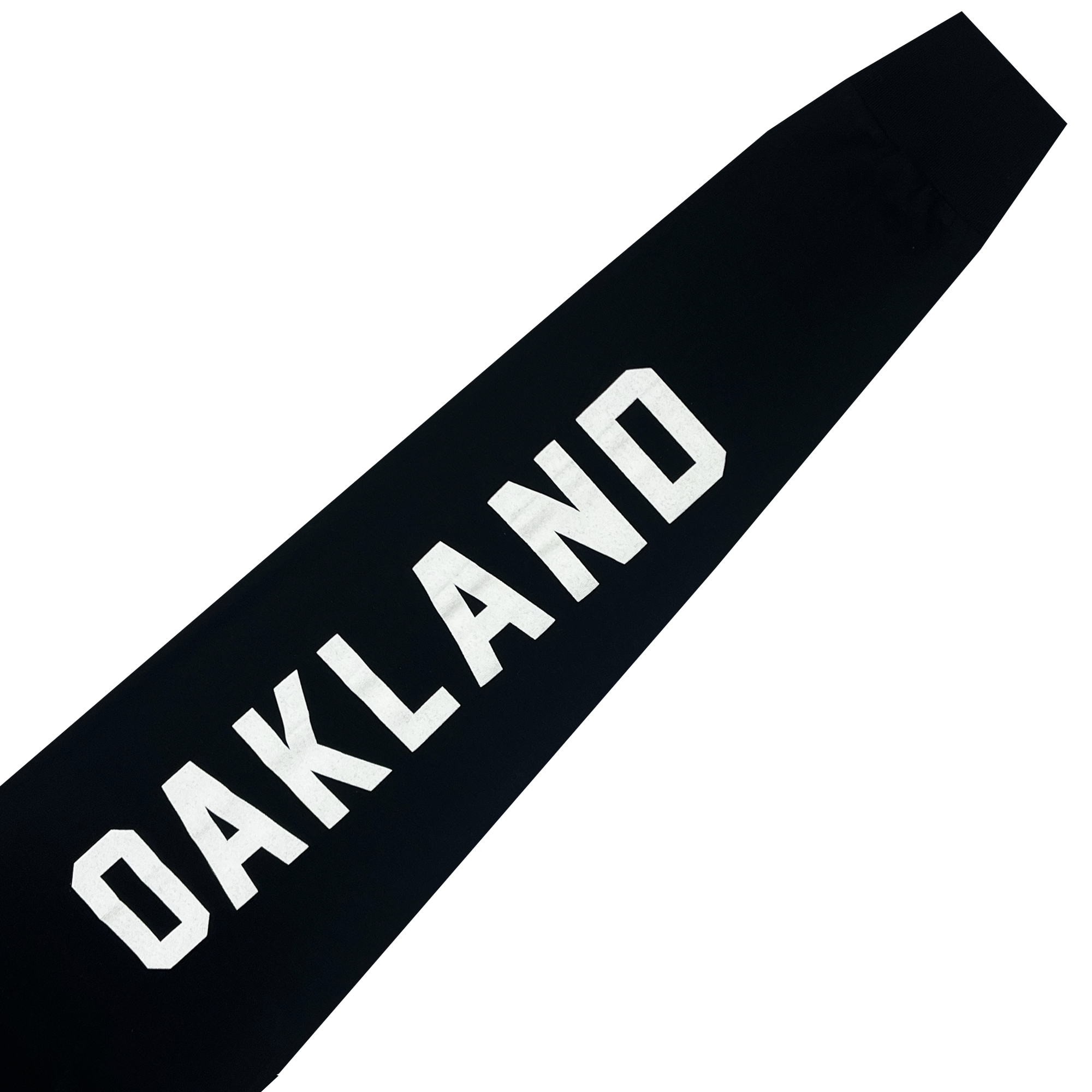 Close-up of a black long-sleeve shirt sleeve with a large white OAKLAND wordmark. 