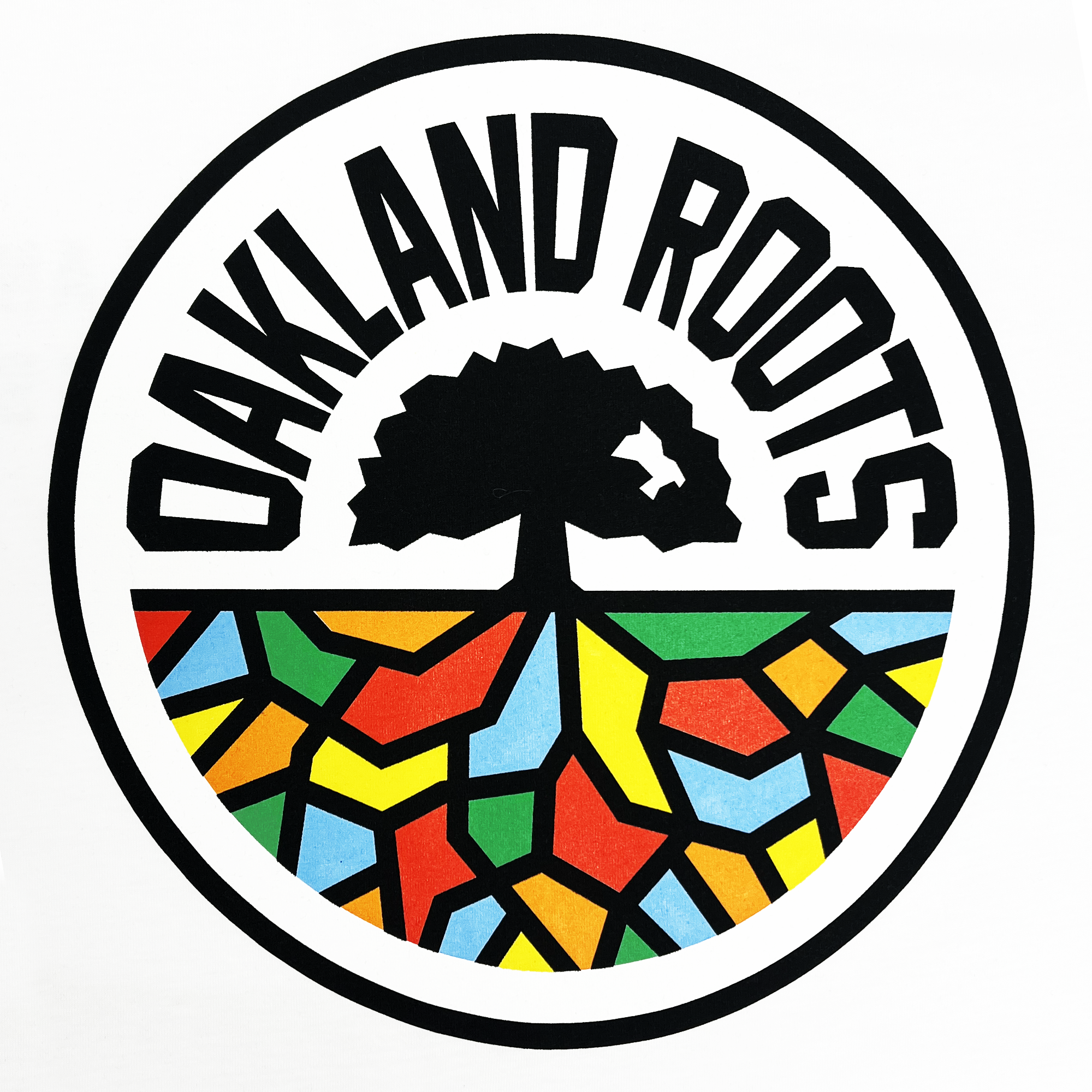 Close-up of the large round multi-color Oakland Roots SC logo on a white long-sleeve shirt.