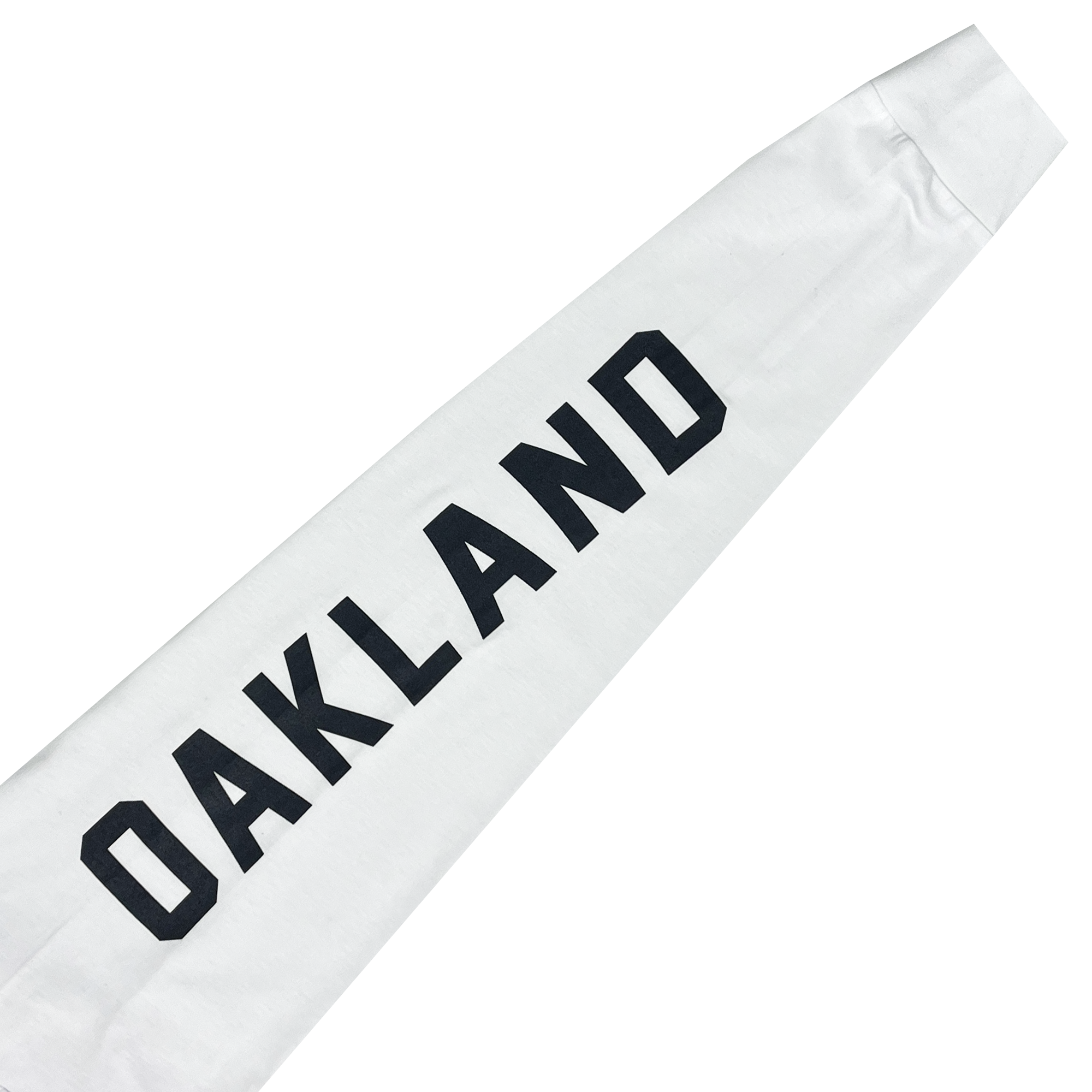 Close-up of a white long-sleeve shirt sleeve with a large black OAKLAND wordmark. 