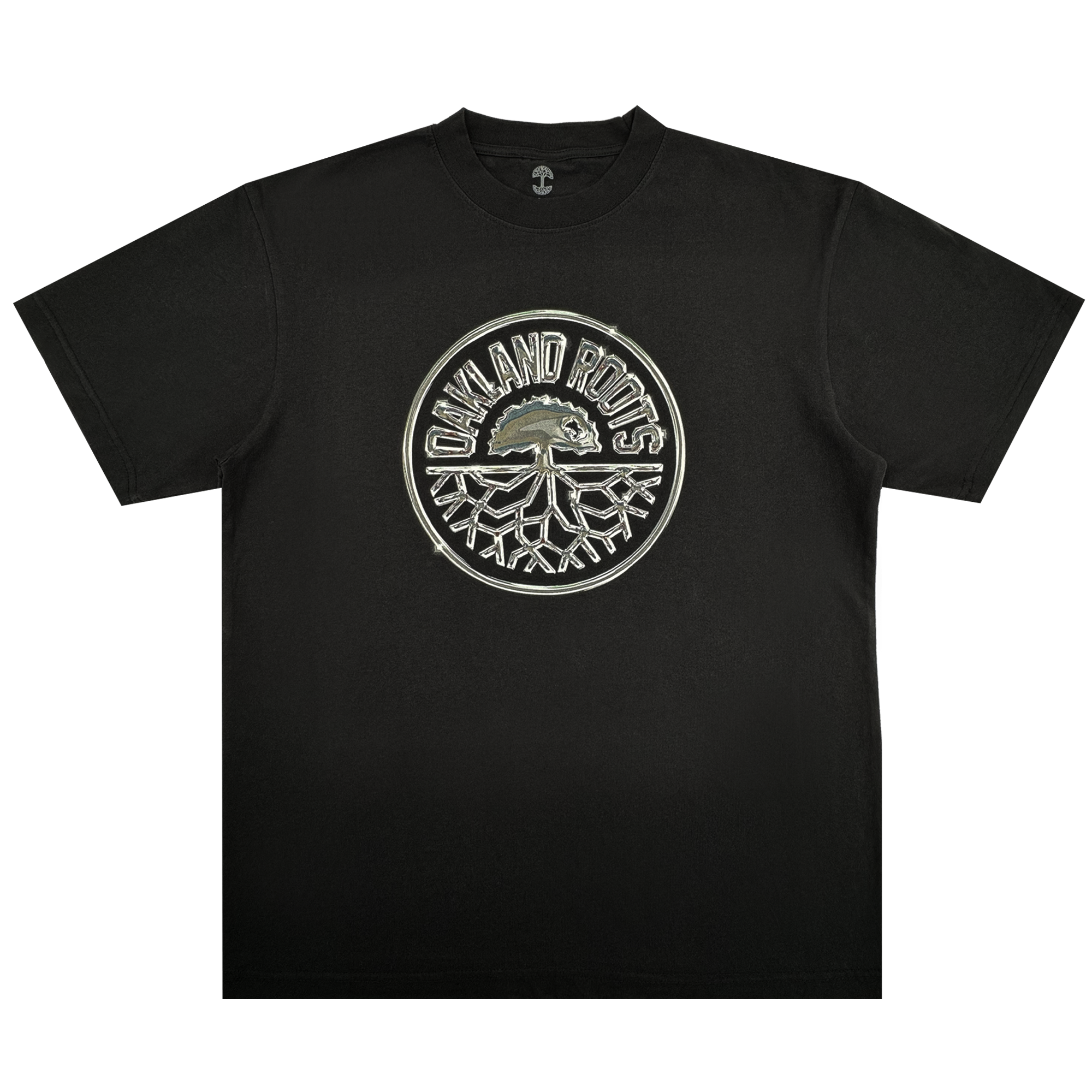 The Platinum Crest Tee by Oakland Roots SC is a black classic-fit t-shirt with a bold circular "OAKLAND ROOTS" logo in white and gray, featuring the iconic tree crest—perfect for any Oakland Roots SC fan.