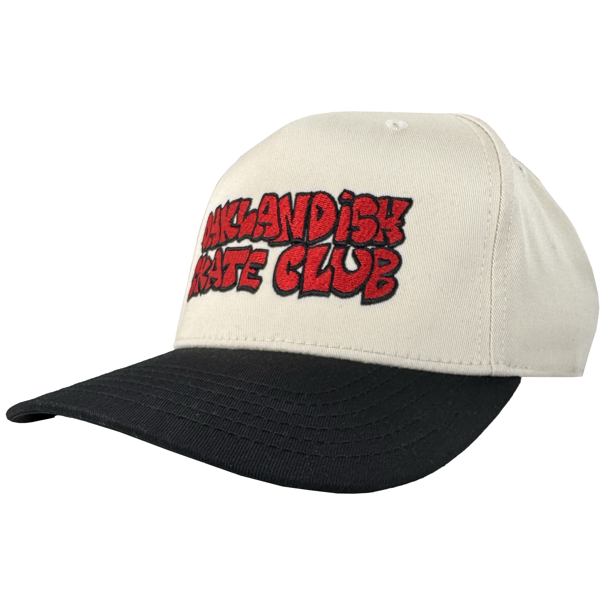 The Oaklandish Skate Club 2-Tone Hat by Oaklandish features a cream crown, black bill, and bold red graffiti-style "OAKLANDISH SKATE CLUB" embroidery outlined in black—an ideal piece for skate culture. Shown on a plain white background.
