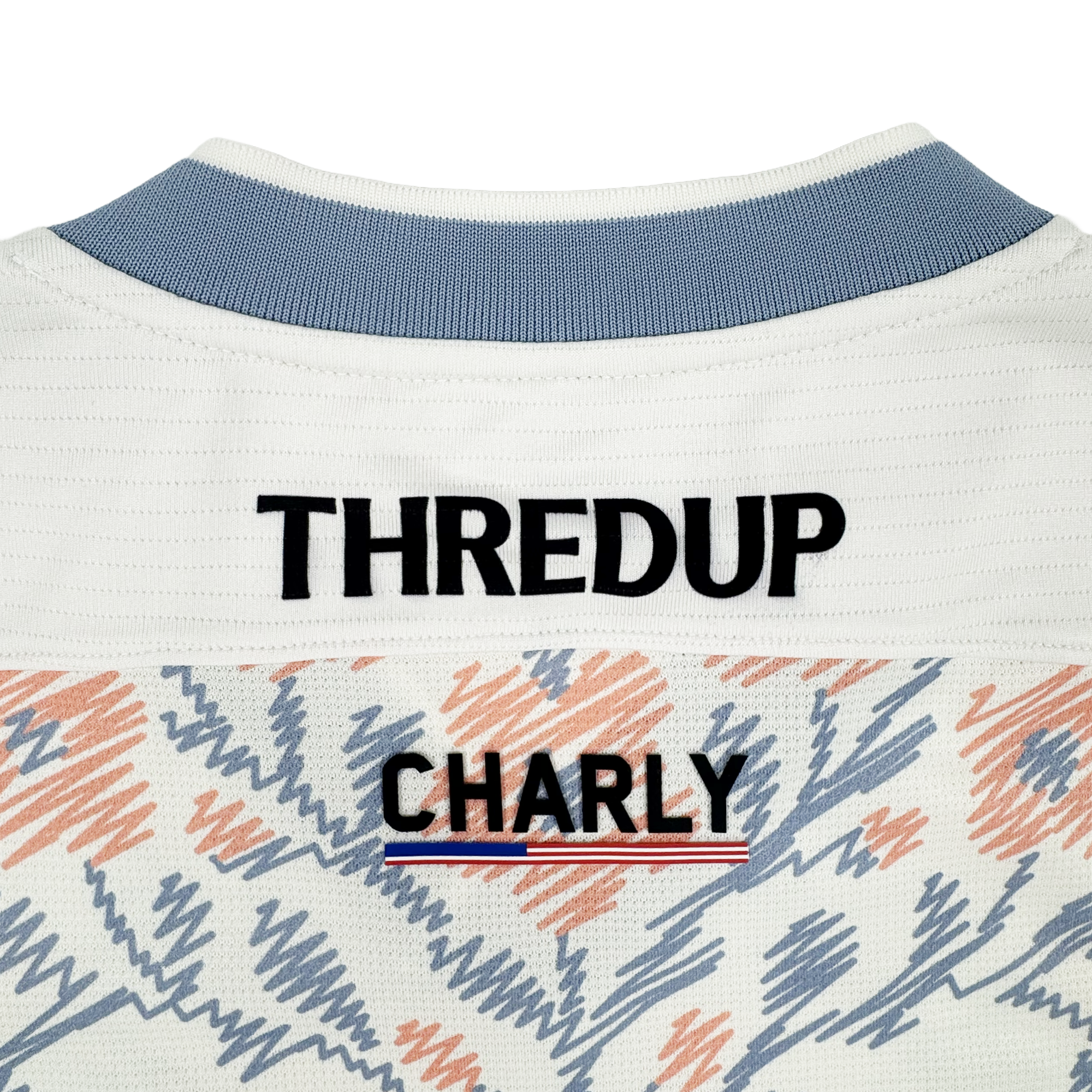 Close-up of the back of a cream Custom 2026 Oakland Soul SC Form Jersey with a light blue collar, "THREDUP" above "Oakland Soul," red, white & blue striped detail, and blue/coral pattern on the special Form Jersey fabric.