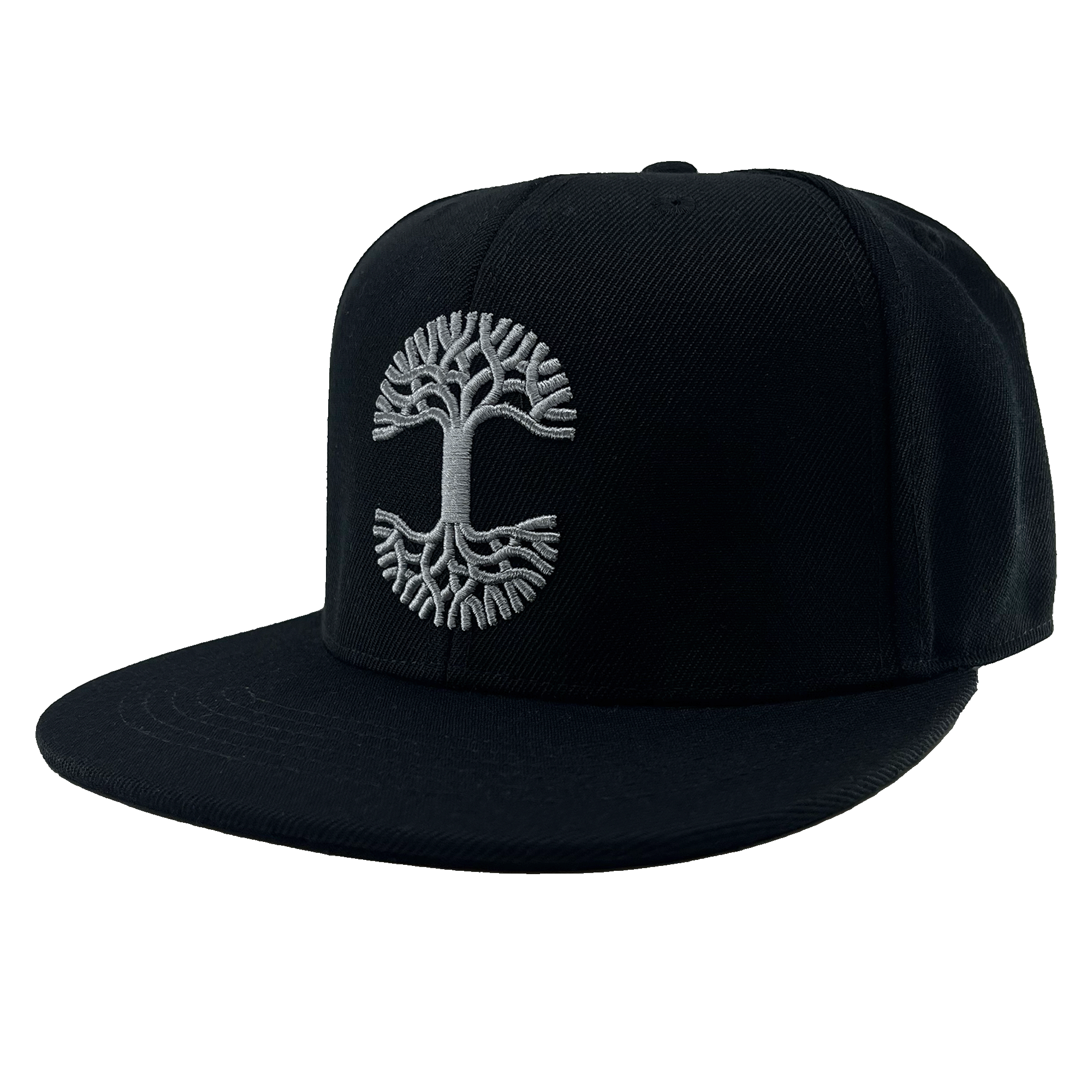 The Town Aft Snapback by Oaklandish is a black, flat-brimmed hat featuring a grey embroidered Oaklandish tree logo on the front panel. The detailed tree logo showcases an intricate root system and branches, forming a symmetrical circular pattern that spans the center of the adjustable snapback. This hat has a structured crown and is made from textured fabric.
