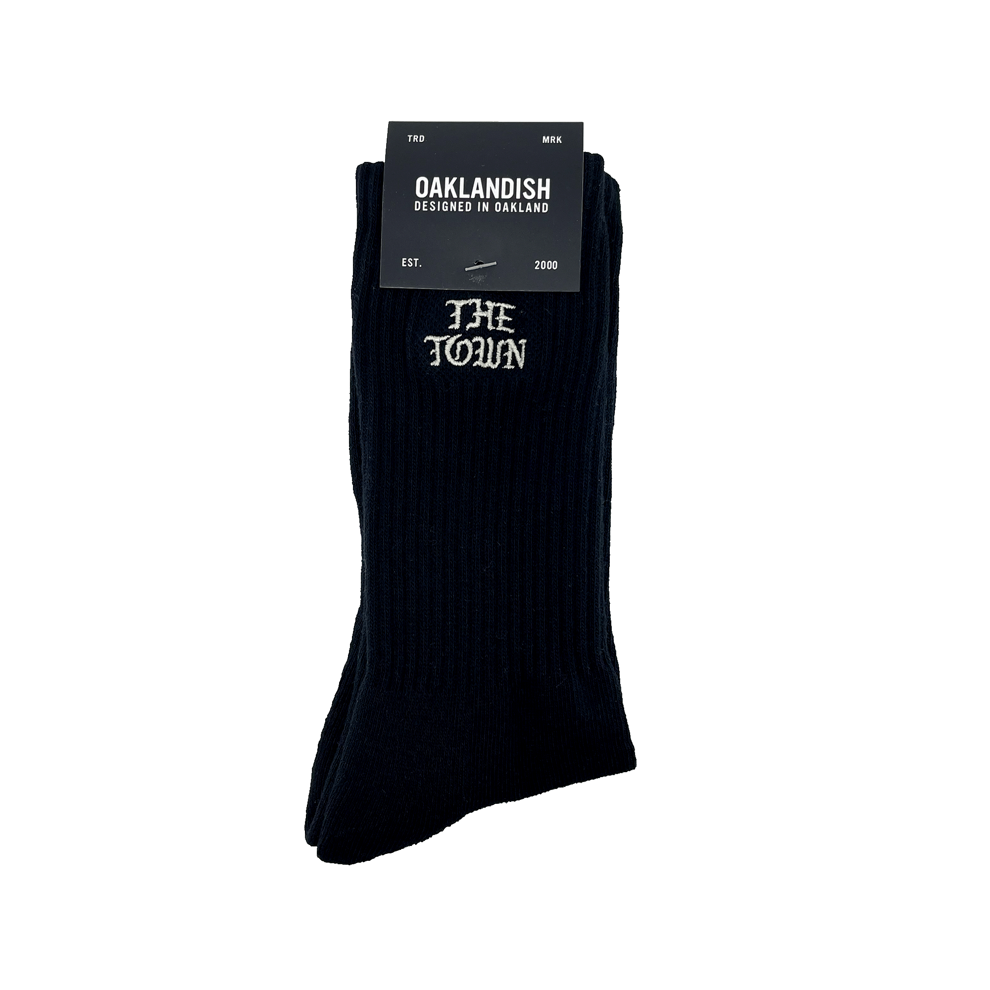 Pair of folded black crew socks in Oaklandish packaging with embroidered white THE TOWN wordmarkin Old Town English on the calves.
