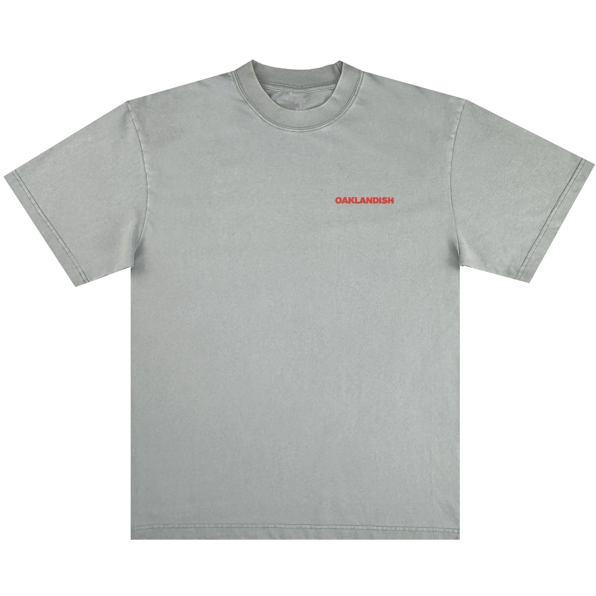 The Oaklandish Tiger Blood Tee is a vintage grey, heavy-weight cotton shirt with "OAKLANDISH" in small bold red uppercase letters on the left chest, ribbed crew neckline, and no other graphics or designs.