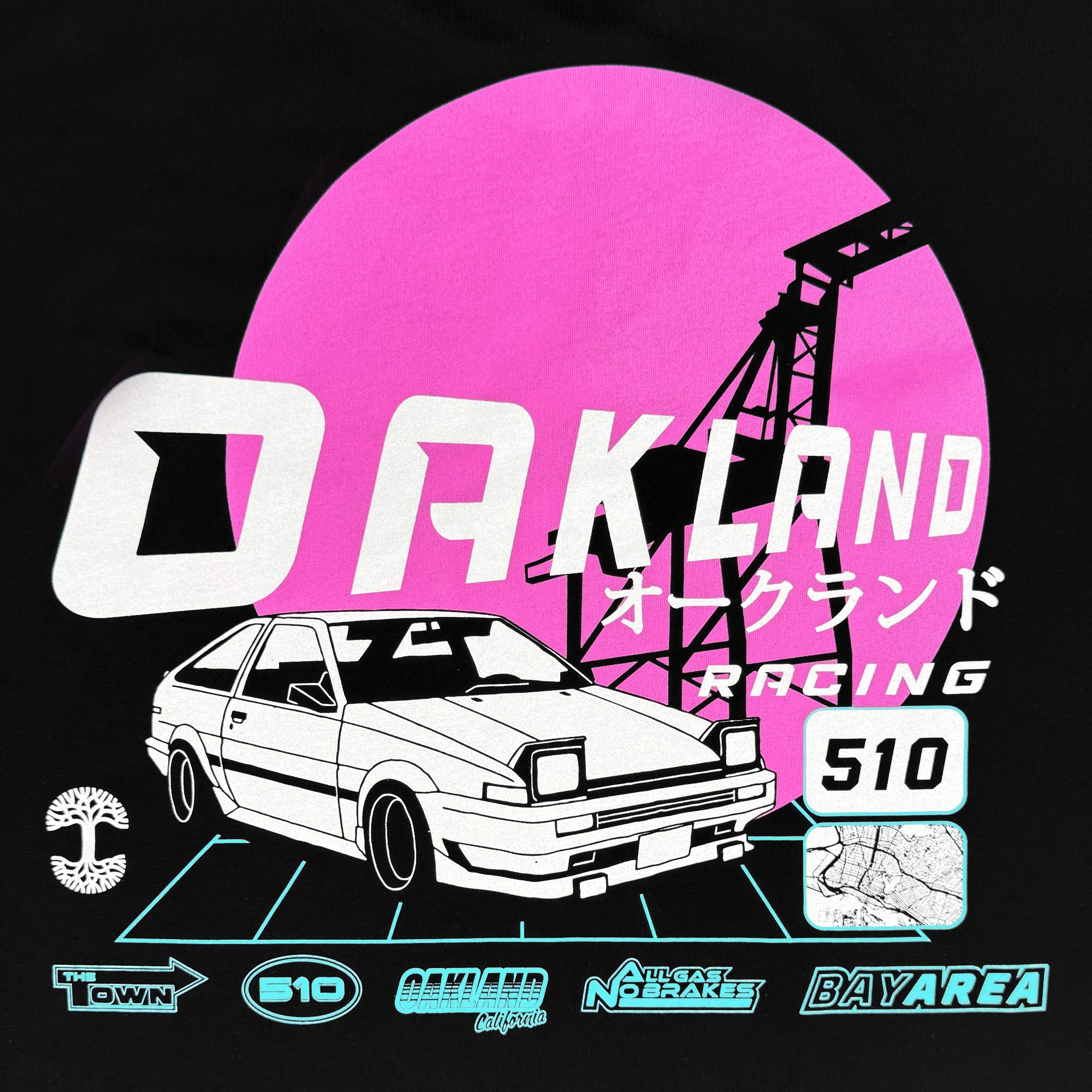 The Tuner Tee by Oaklandish is a classic fit men's t-shirt featuring a retro graphic of a white sports car under "OAKLAND" and framed by a pink sun and black backdrop. Made from 100% cotton, it includes Japanese text, iconic logos, and an industrial crane silhouette.