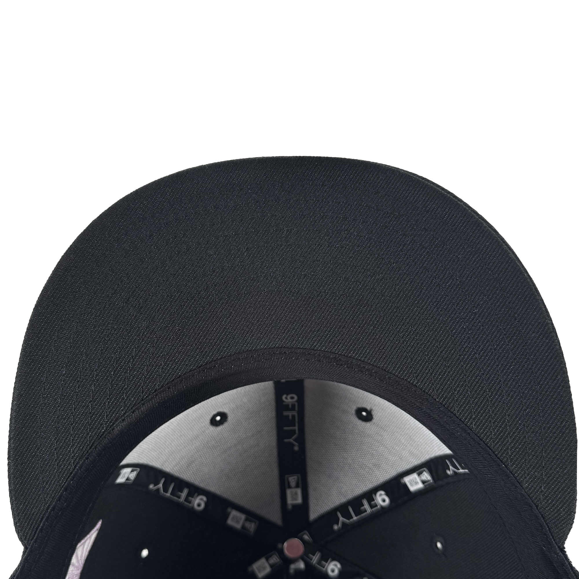 Close-up, top-down view of the GSV Logo 2 9TWENTY Hat by GSV. This black cap features an adjustable strap back, silver eyelets, visible stitching, and black taping with white “9TWENTY” labels on the textured brim and inside lining.