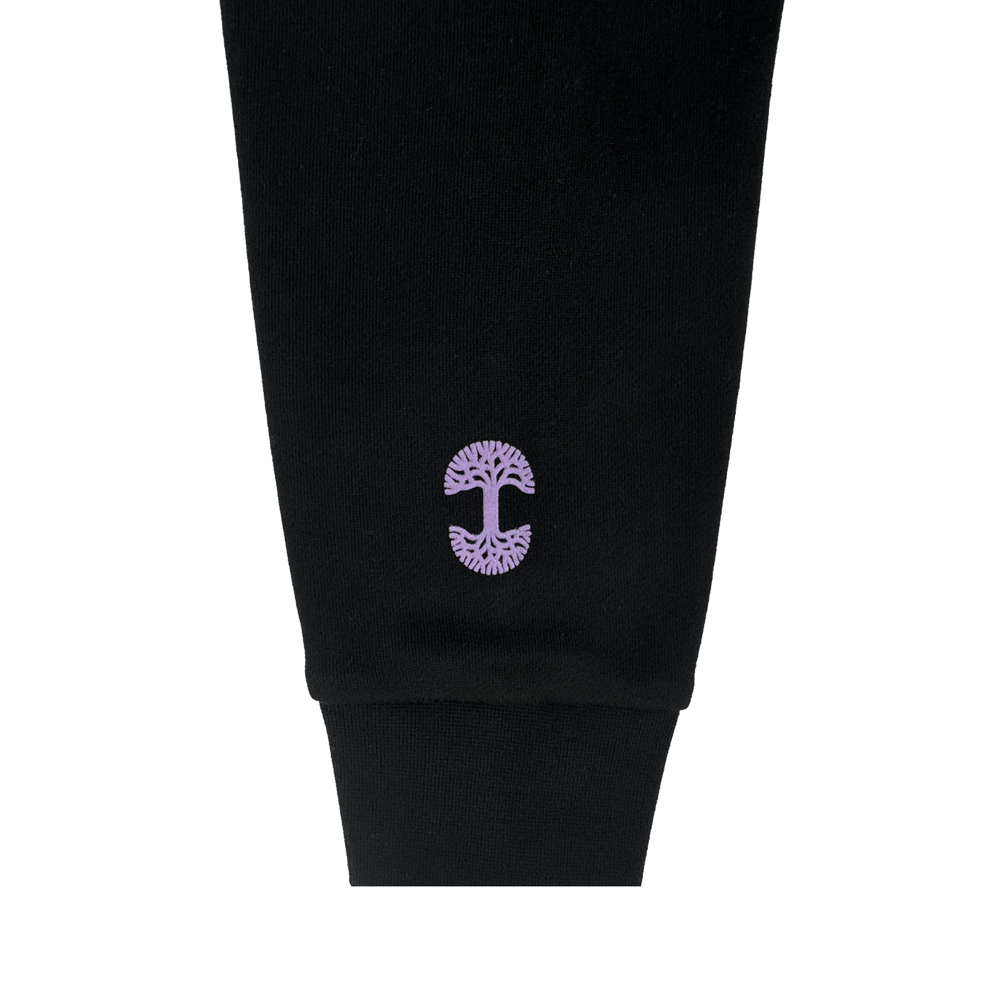 A close-up of the black GSV Odin Hoodie sleeve with a ribbed cuff in unisex sizing. Near the cuff, a purple Golden State Valkyries logo with mirrored branches and roots is embroidered. The background is plain white.
