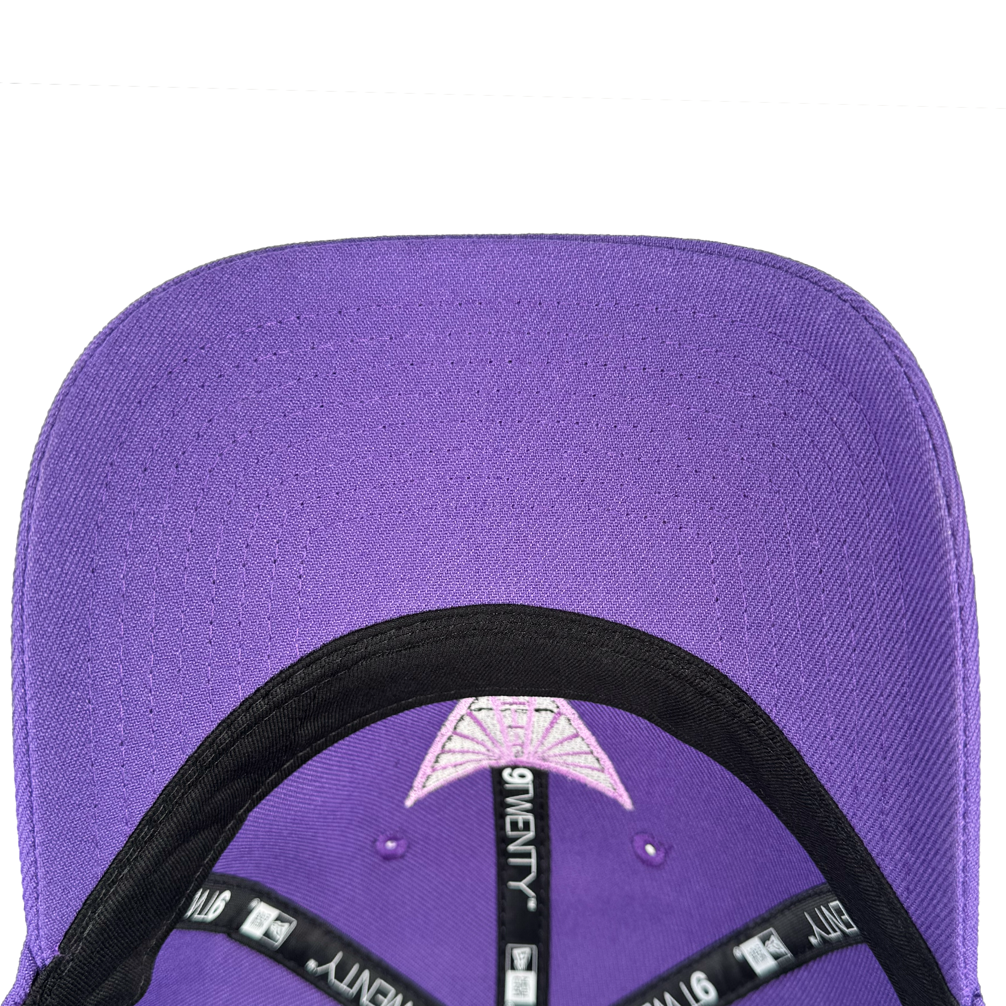 A close-up of the purple GSV 9TWENTY cap shows black inner seams and a white GSV label. Both the crown and visor are purple, with a small triangle stitching detail above the brim.