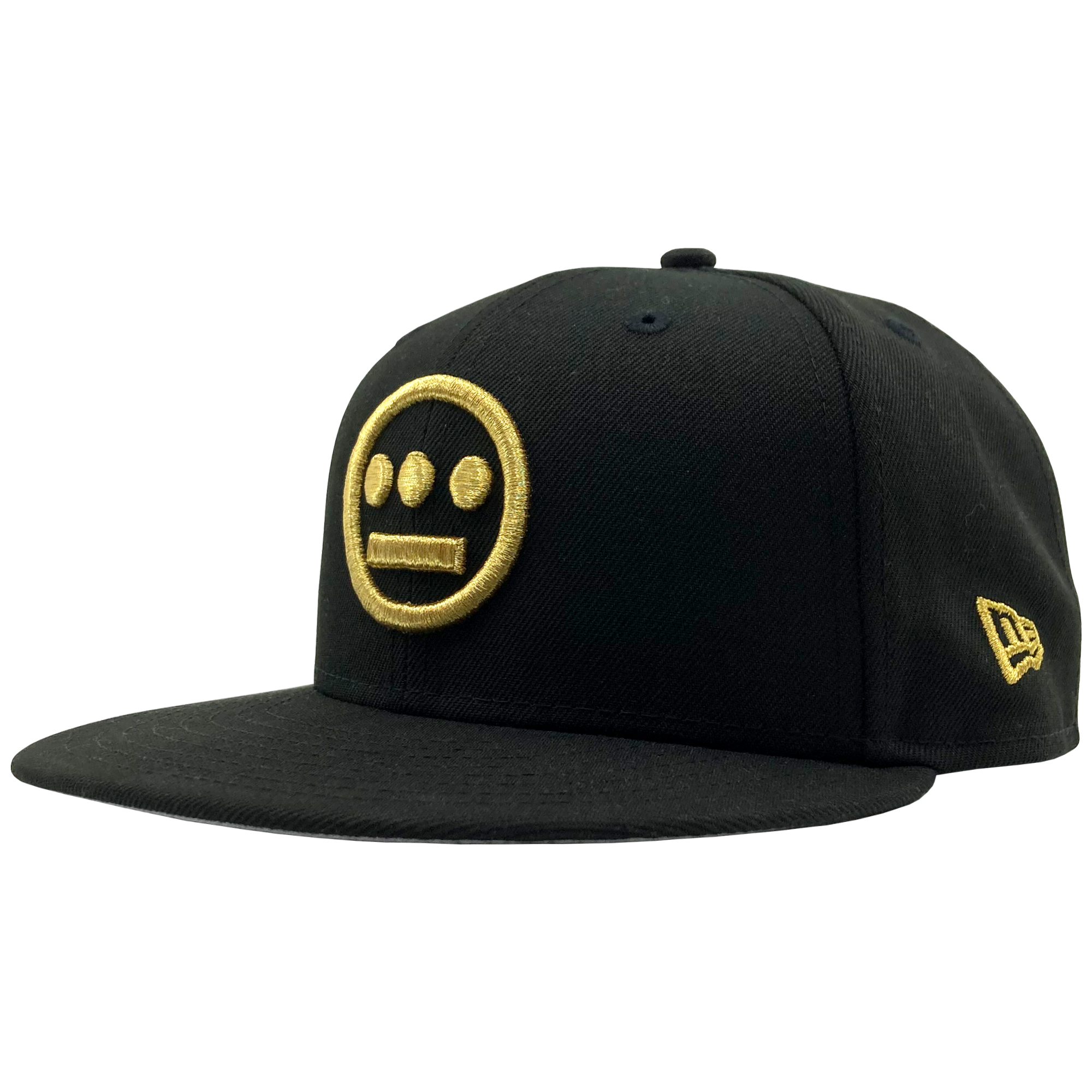 Side view of black New Era fitted cap with gold embroidered Hiero hip-hop logo on the crown.