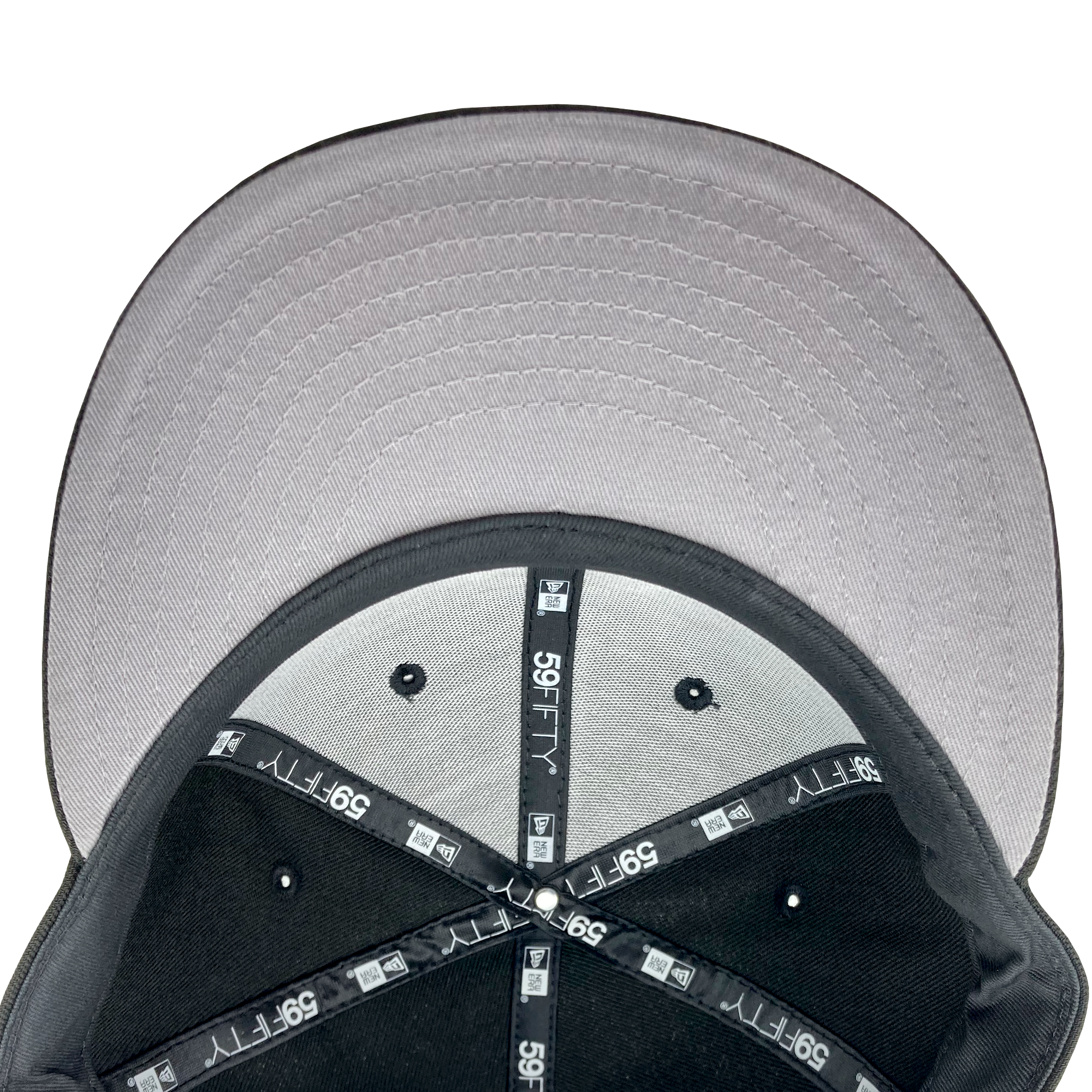 A close-up view of the inside of a New Era Hiero 59FIFTY Fitted Cap by Hieroglyphics, showcasing its grey and black design. The underside of the bill is grey, complementing the black interior panels with grey seams. The tape inside this cap features the "59FIFTY" and New Era logos in white, and the top button is covered in matching fabric.