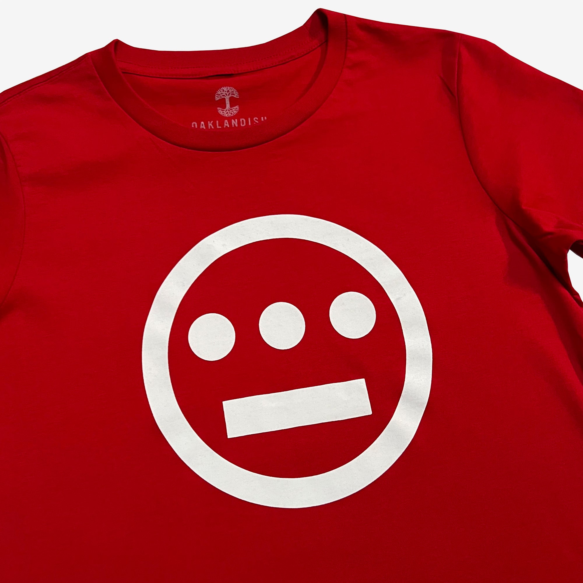 Close up of white Hieroglyphics Hip-Hop logo on a red t-shirt.