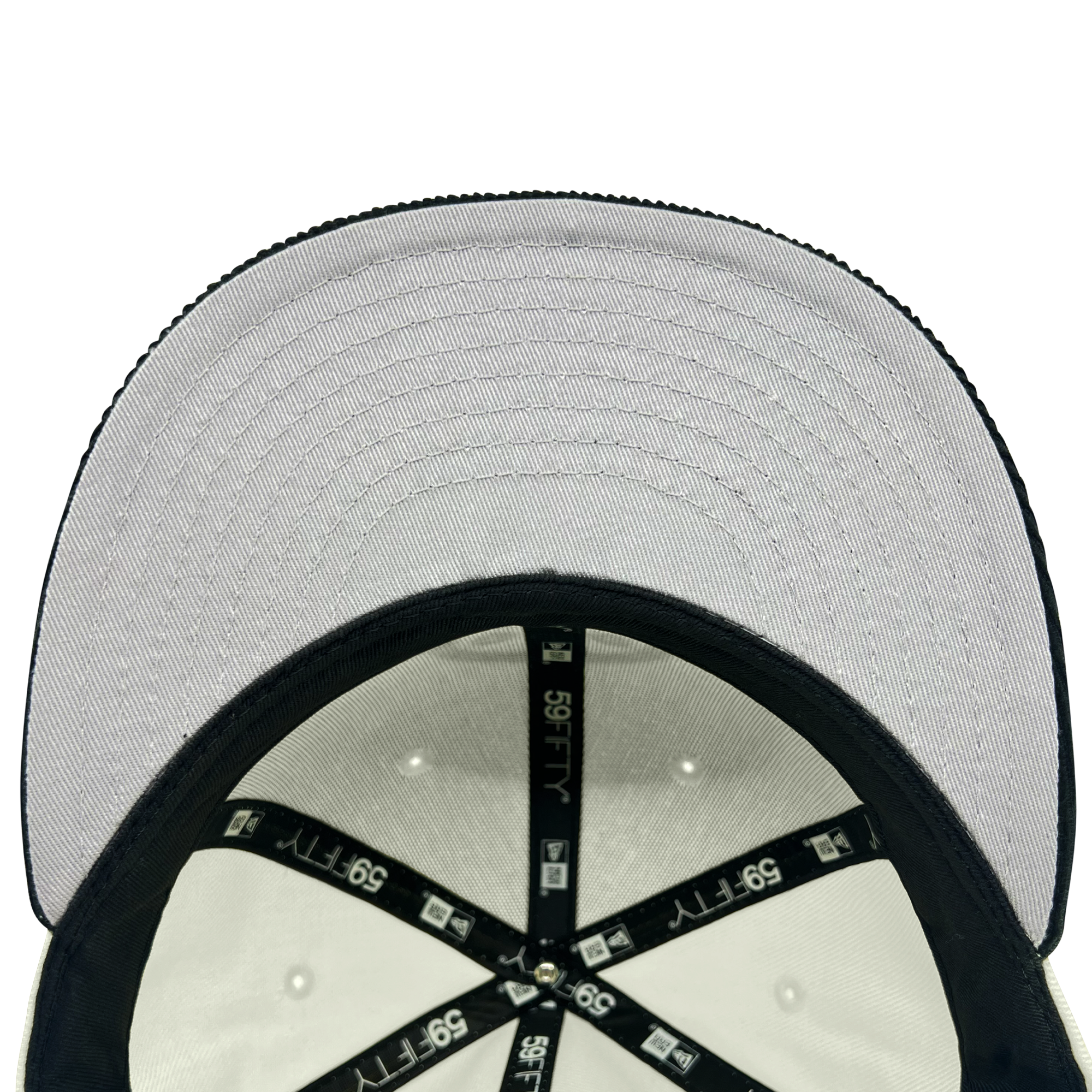 Inside view of the crown of New Era 59FIFTY fitted chrome hat with black New Era taping and grey under visor.