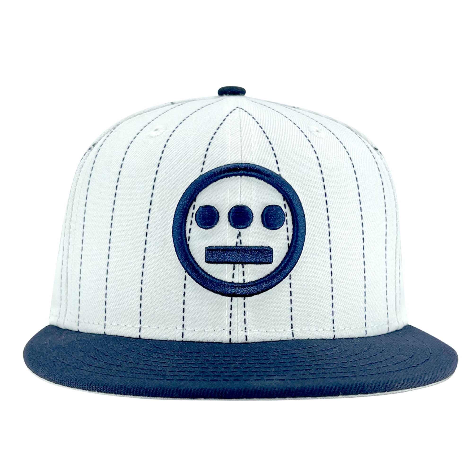 The New Era Hiero Pinstripe 59FIFTY Fitted Cap by Hieroglyphics is a white fitted cap adorned with thin vertical black stripes and features a prominent navy blue round emblem with three dots in a row above a horizontal line. The solid navy blue brim complements the emblem, reflecting New Era's signature clean and minimalistic design.