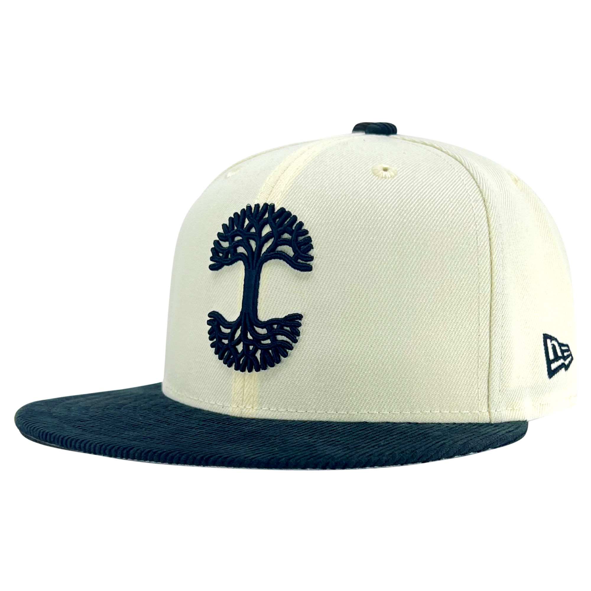The New Era X Oaklandish Classic Cord 59FIFTY Fitted Cap by Oaklandish is cream-colored with a navy blue flat brim and a prominently embroidered navy blue tree emblem on the front. The Oaklandish logo appears in white on the side, complemented by a button on top and ventilation holes for breathability.