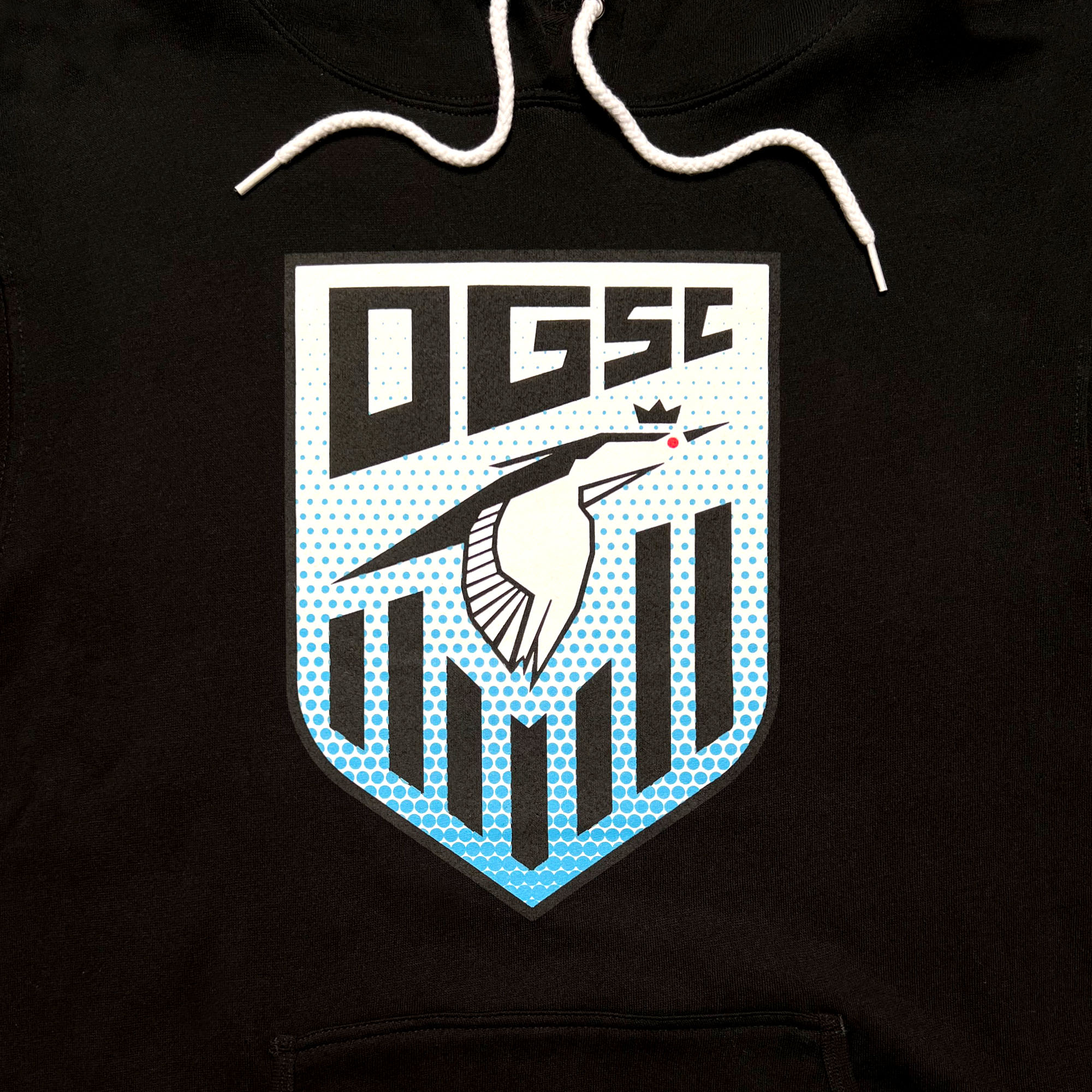 Close-up of Oakland Genesis soccer league heron logo on a black hoodie.