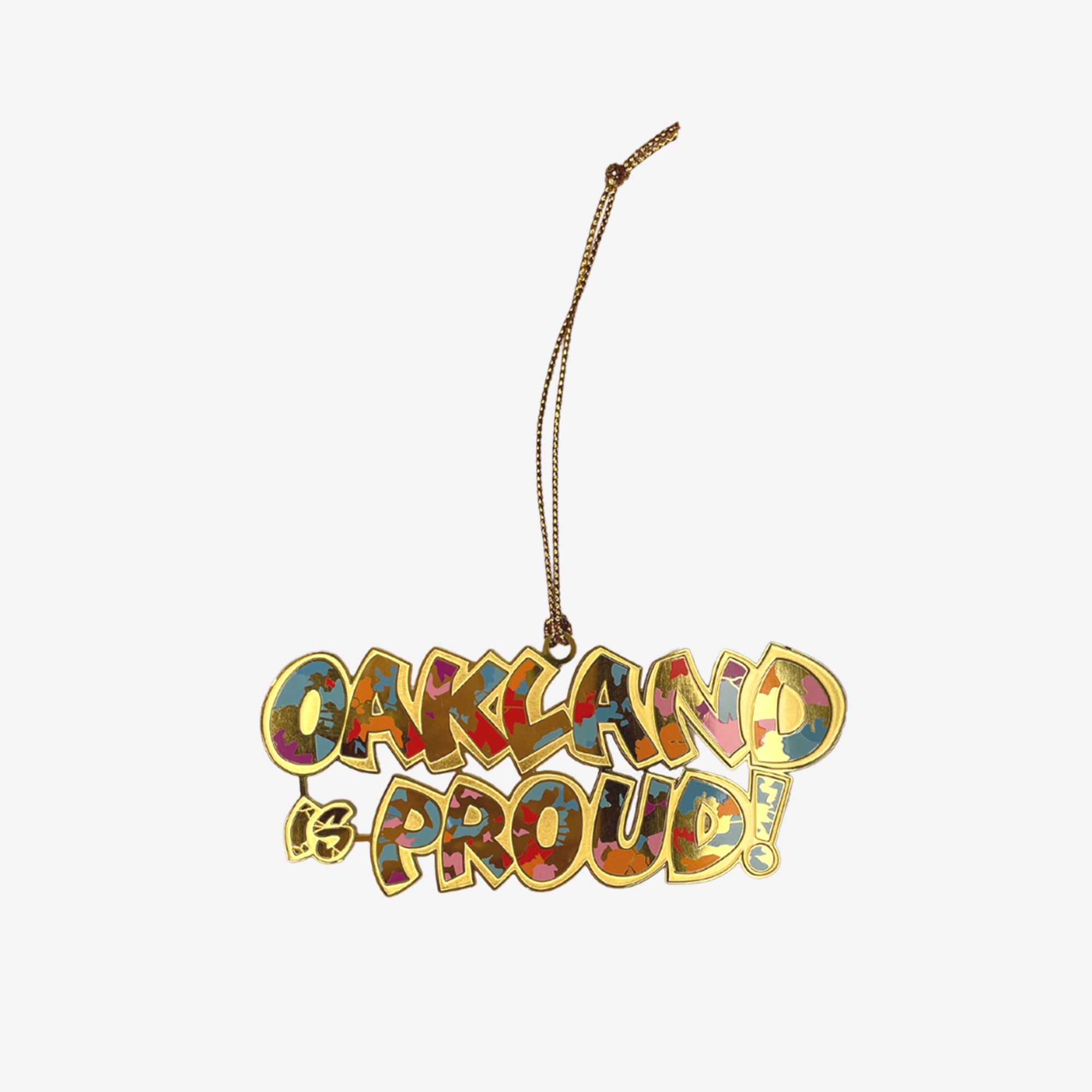 Oakland is Proud full-color wordmark depicted in cut-out brass holiday ornament.